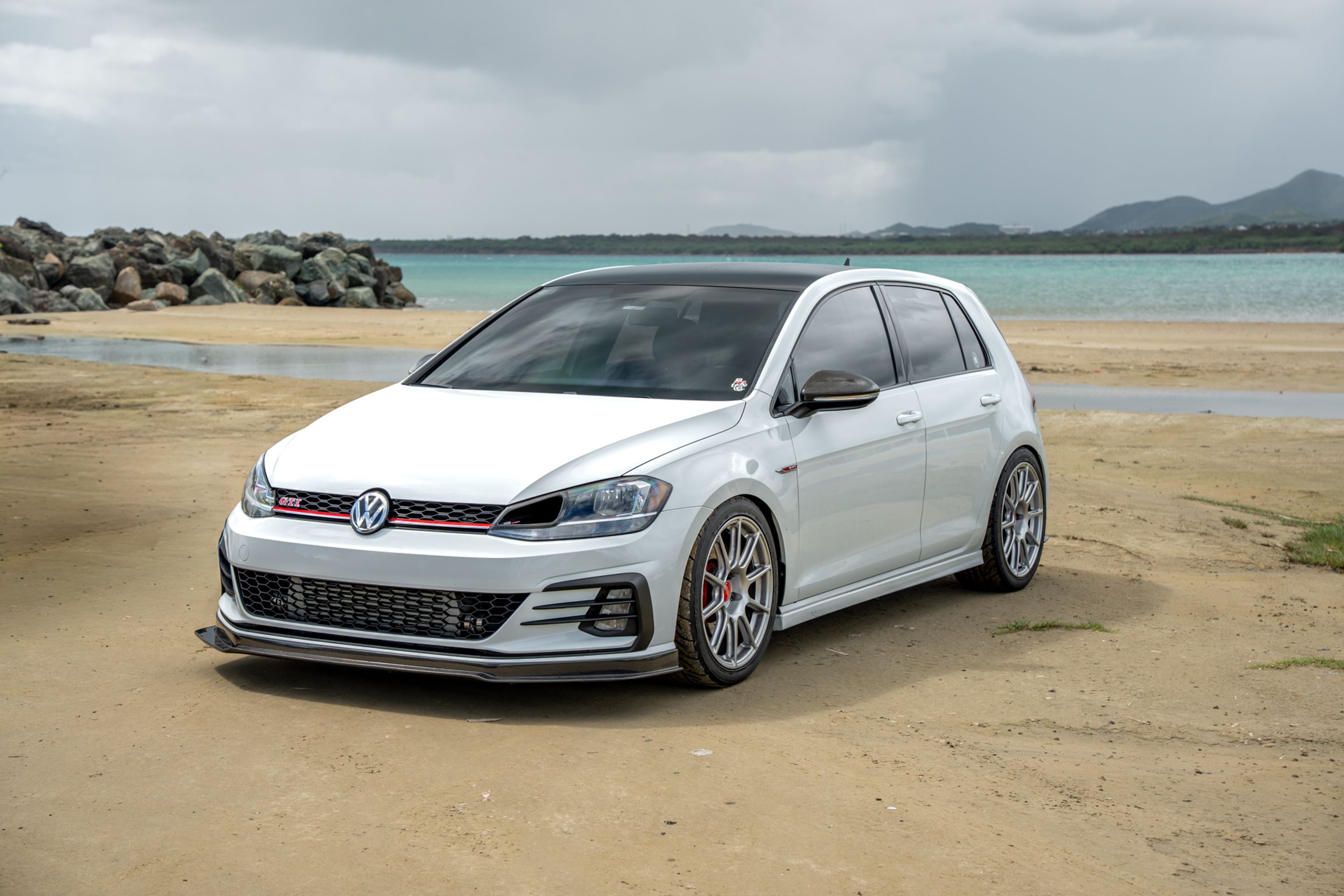 White VW MK7 GTI with 18" SM-10 Apex wheels in Race Silver