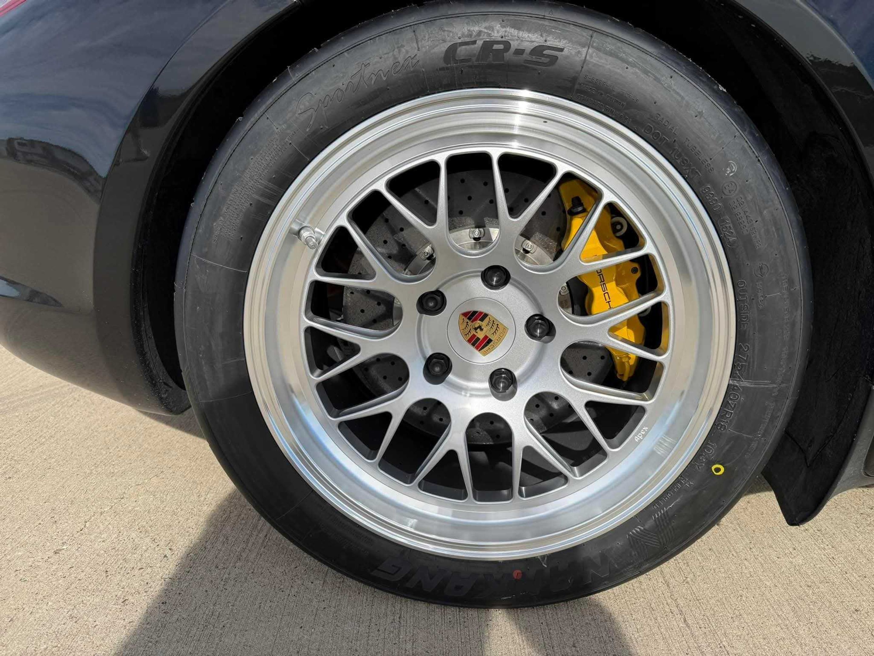 Black Porsche 987 Cayman R with 18" ML-10RT Apex wheels in Machined Lip Race Silver