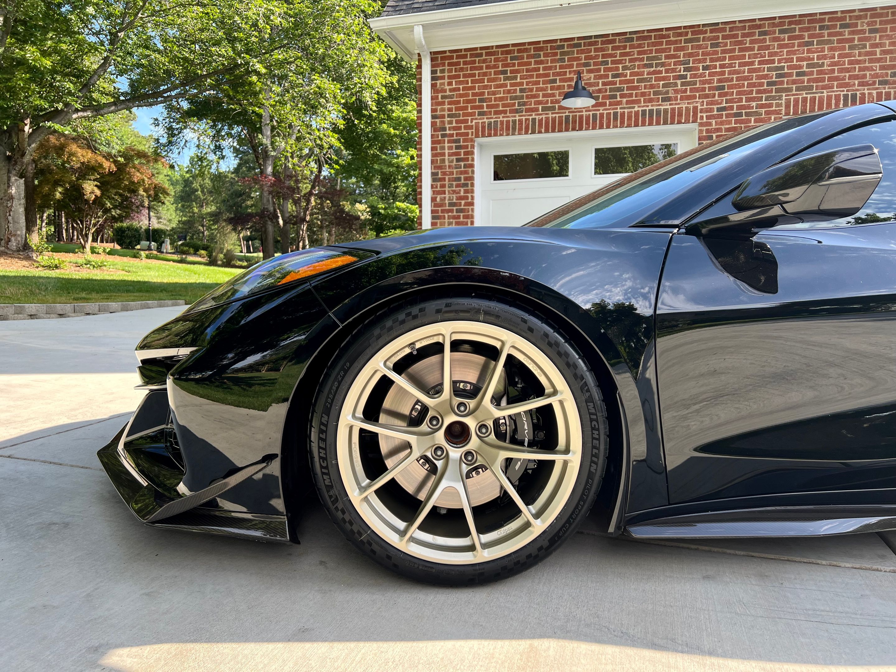 Black Chevrolet C8 Corvette Z06 with 19" VS-5RE Apex wheels in Motorsport Gold