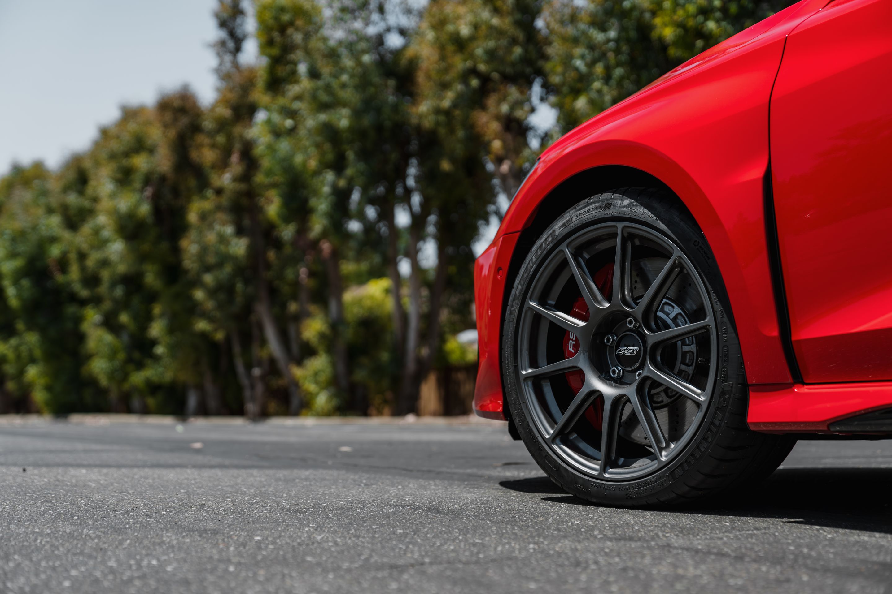 Red Audi 8Y RS 3 with 18" SM-10 Apex wheels in Anthracite