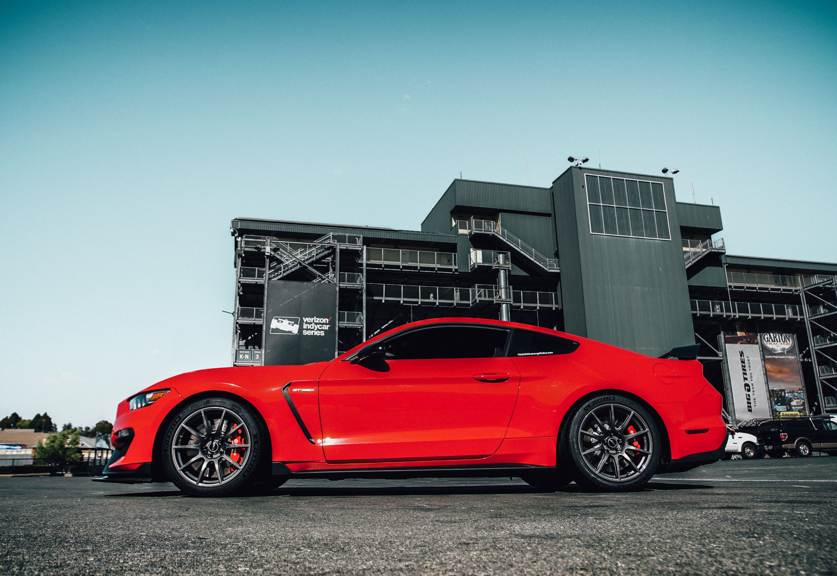 Red Ford S550 Mustang GT350 with 19" SM-10 Apex wheels in Anthracite
