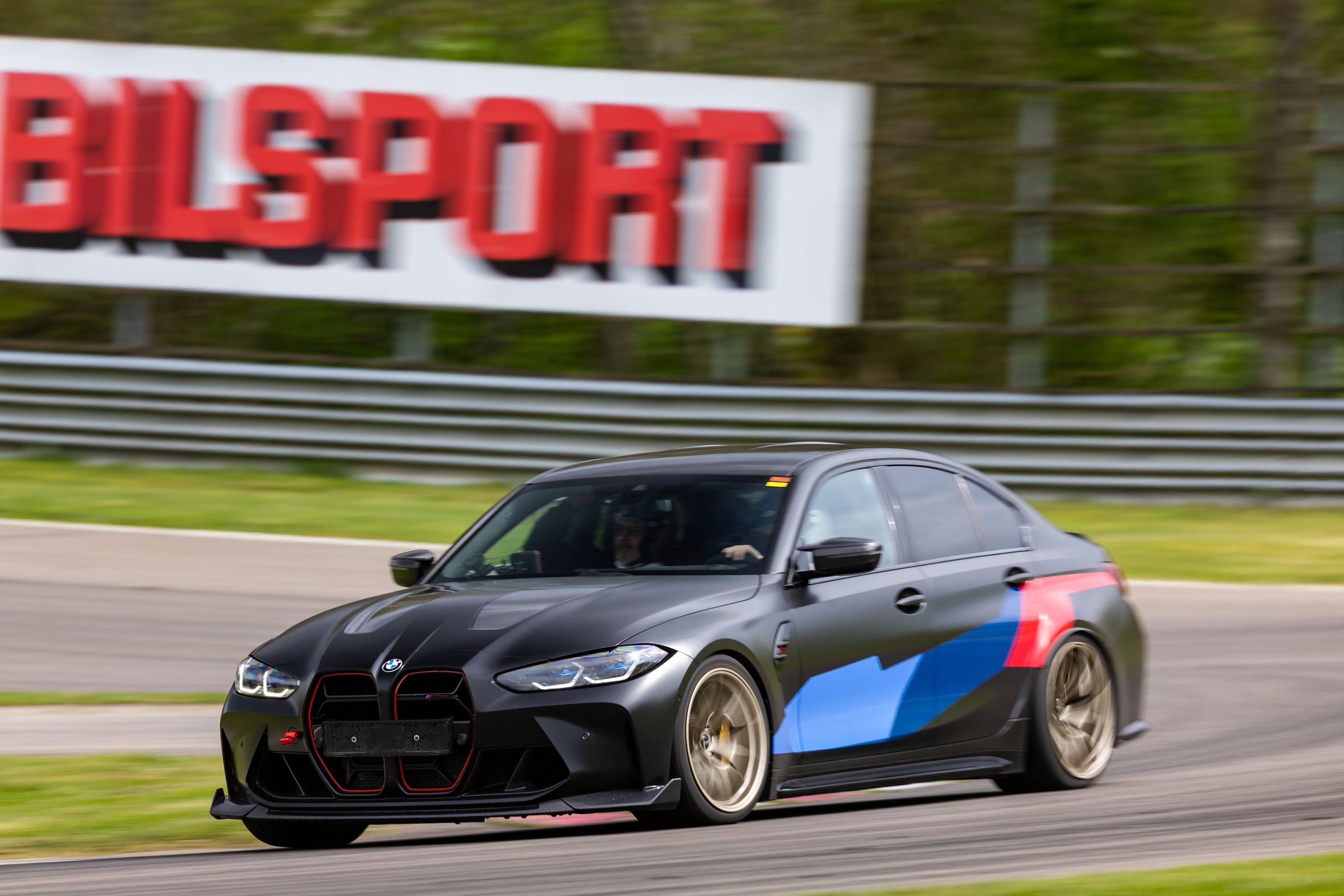 Black BMW G80 M3 with 19" VS-5RS Apex wheels in Motorsport Gold