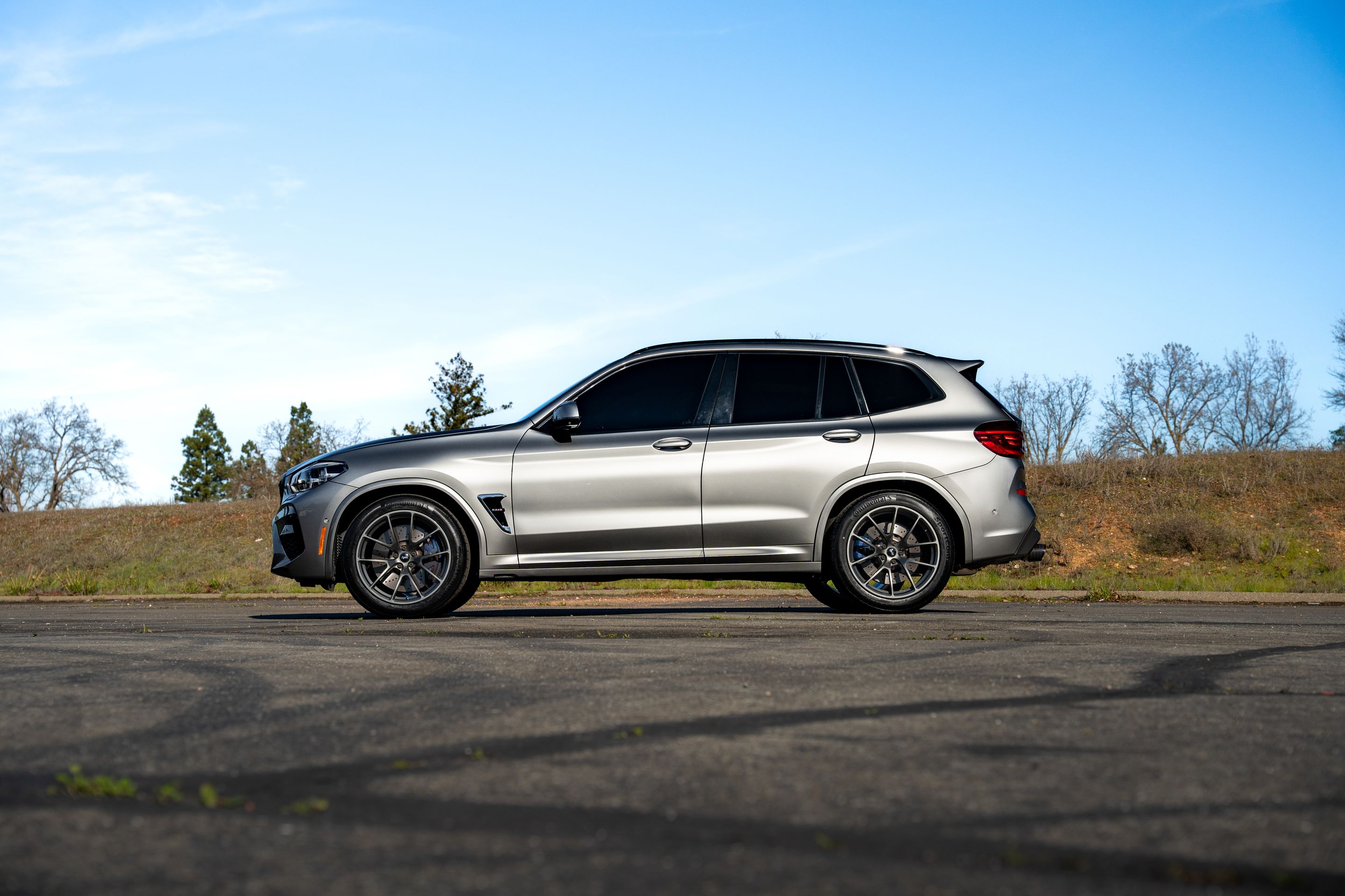 Silver BMW F97 X3M with 20" VS-5RX Apex wheels in Anthracite