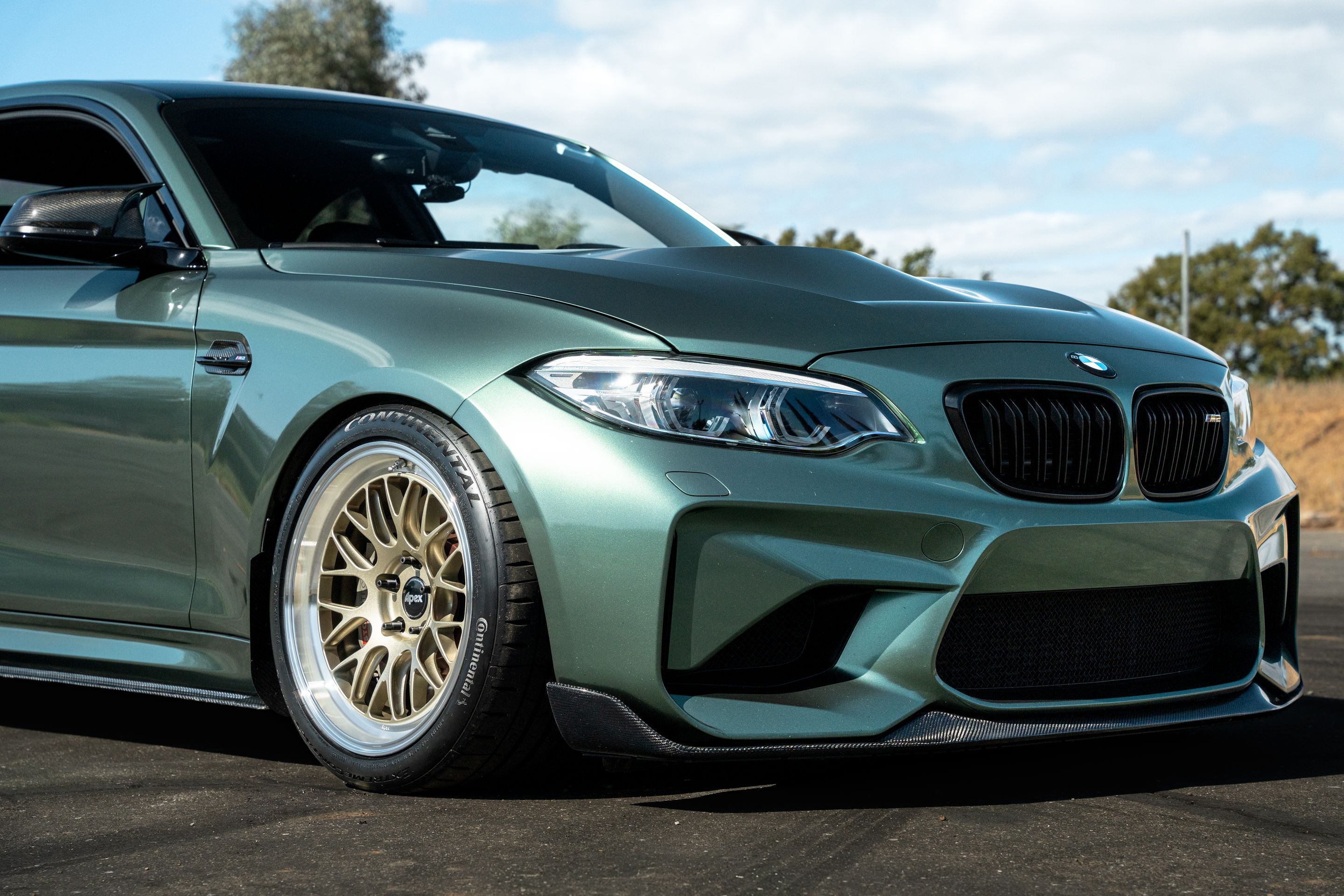 Green BMW F87 M2 with 18" ML-10RT Apex wheels in Machined Lip Gloss Motorsport Gold