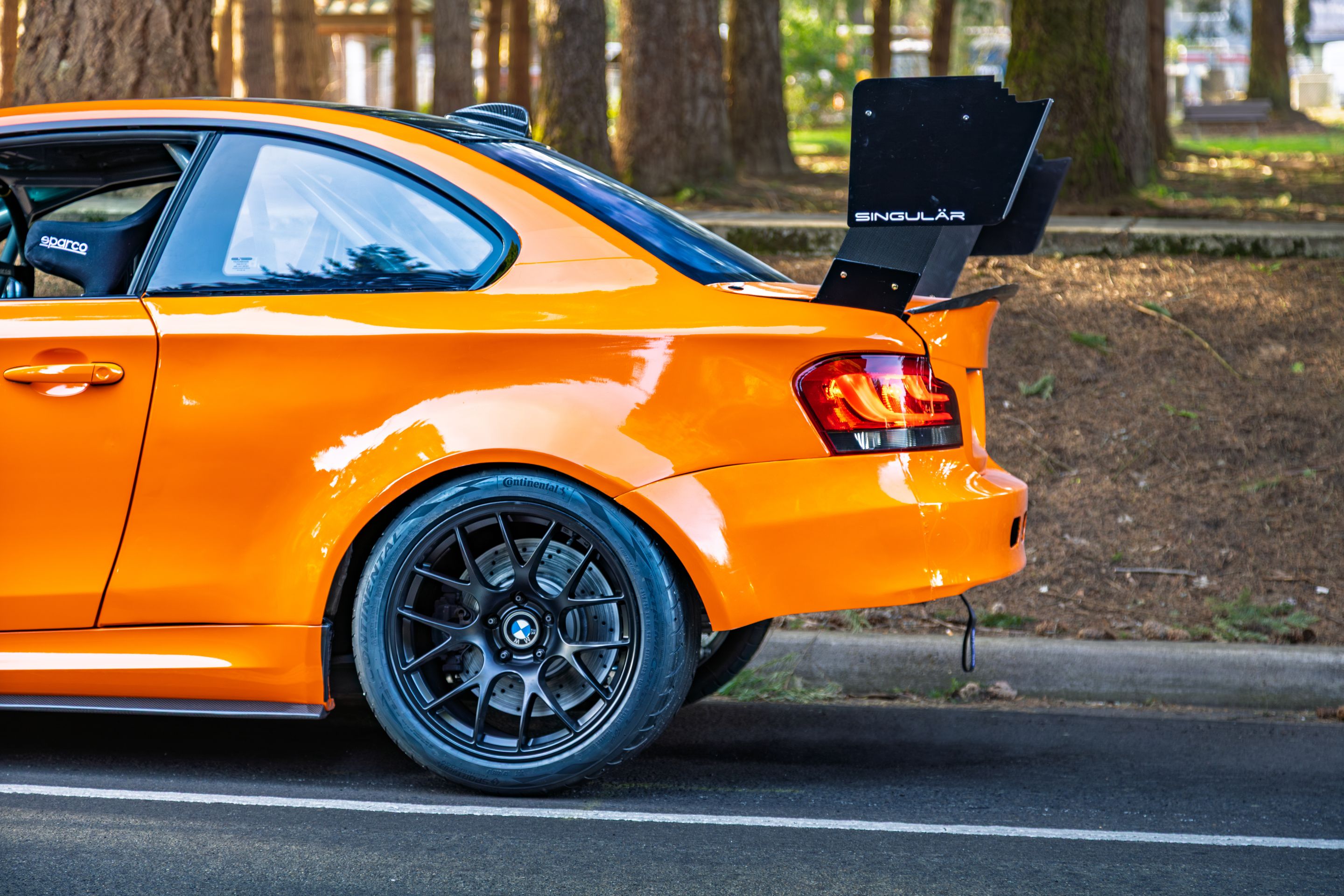 Orange BMW E82 1M with 18" EC-7 Apex wheels in Satin Black