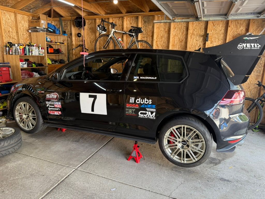 Black VW MK7 GTI with 18" TC-10RT Apex wheels in Motorsport Gold