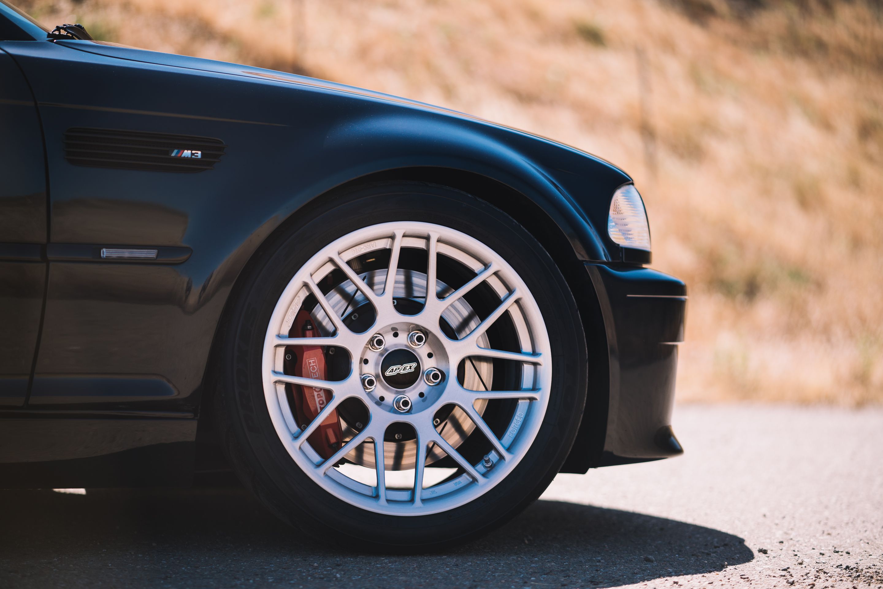 Black BMW E46 M3 with 18" ARC-8R Apex wheels in Brushed Clear