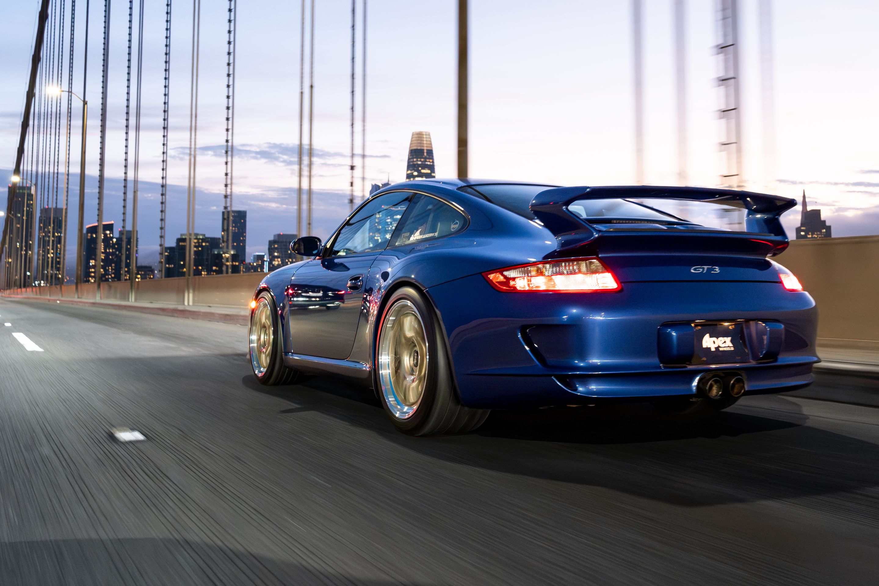 Blue Porsche 911 997 GT3 with 19" TEST-M Apex wheels in Machined Lip Gloss Motorsport Gold