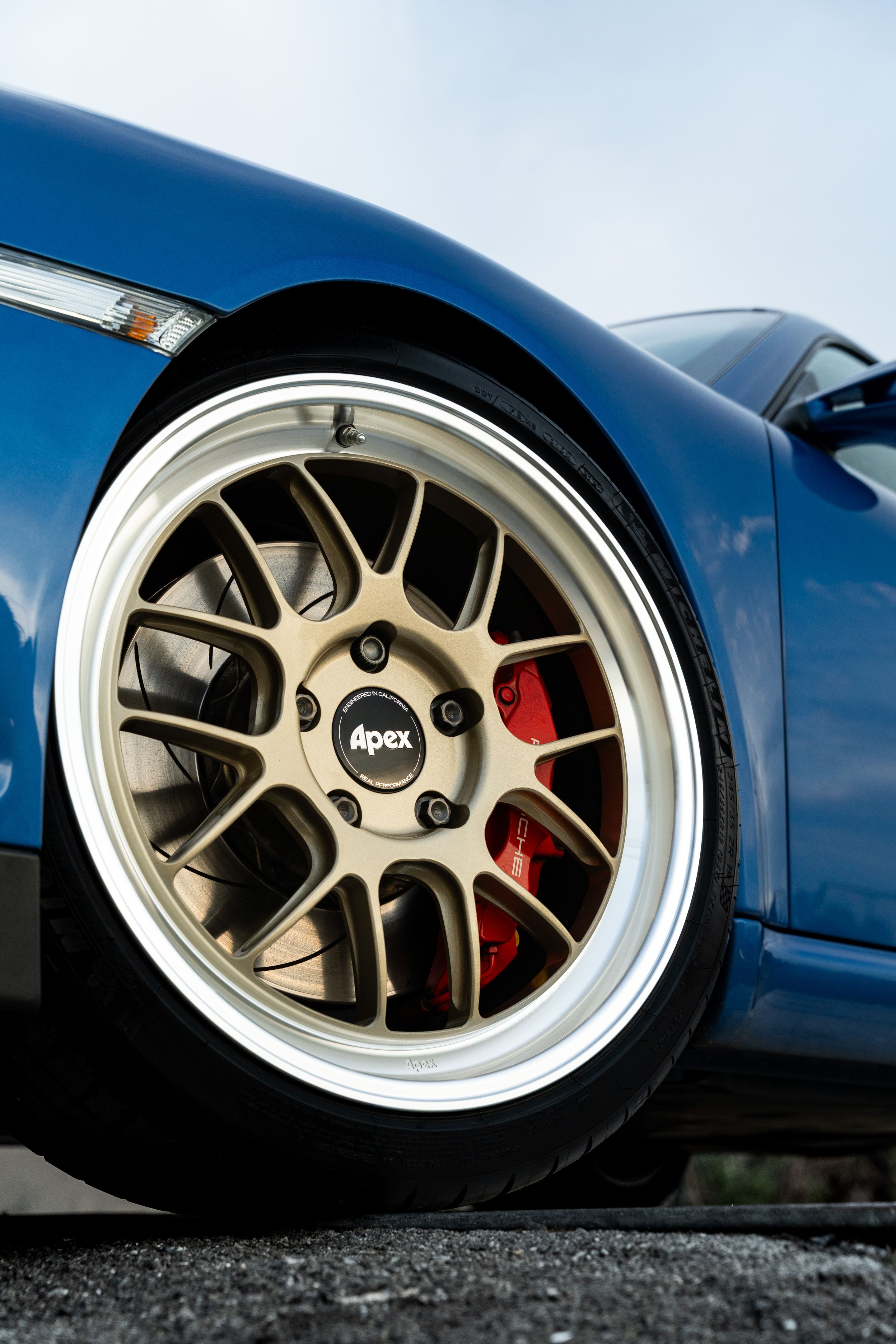 Blue Porsche 911 997 GT3 with 19" TEST-M Apex wheels in Machined Lip Gloss Motorsport Gold