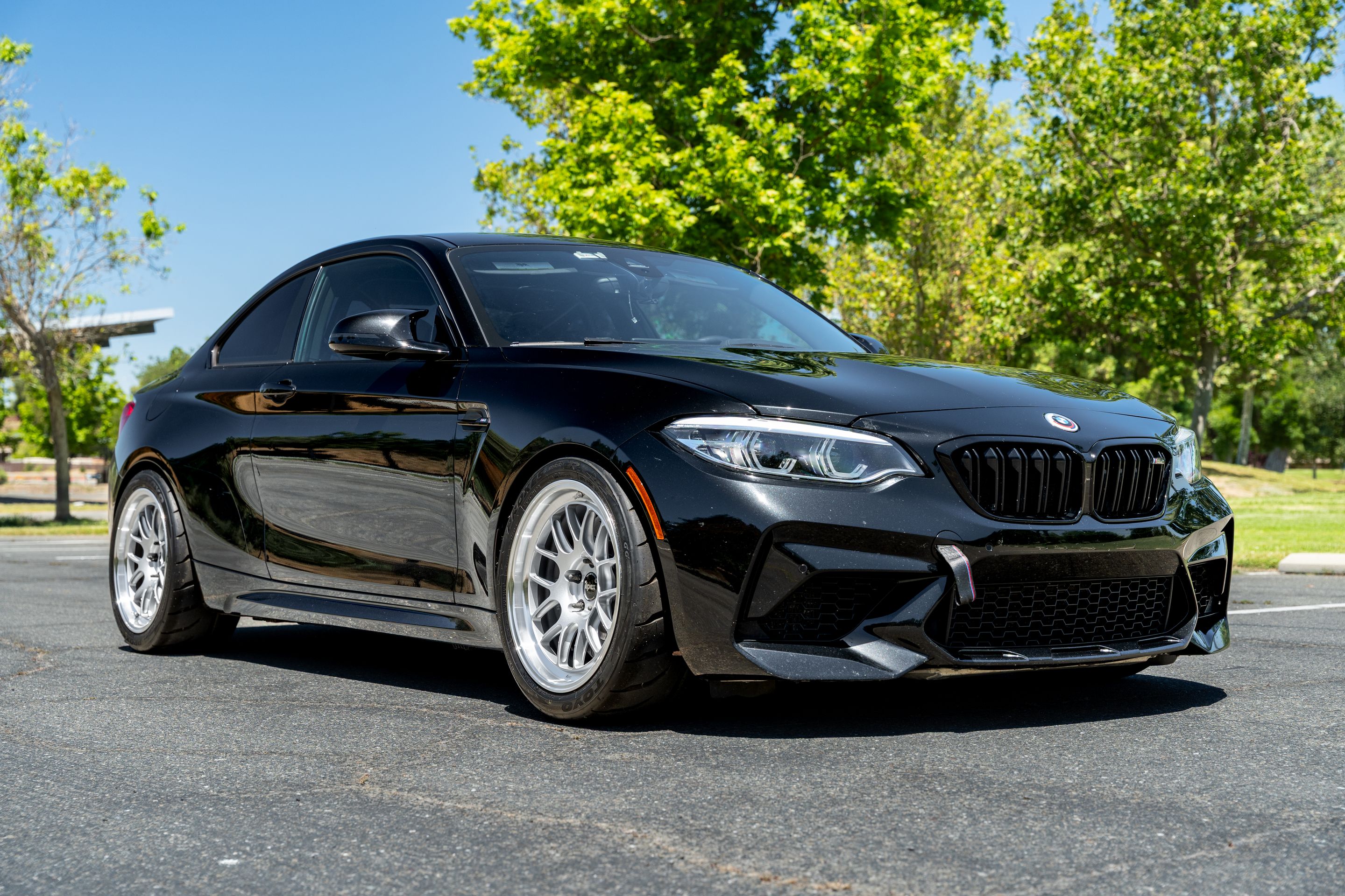 Black BMW F87 M2 with 18" ML-7RT Apex wheels in Machined Lip Race Silver