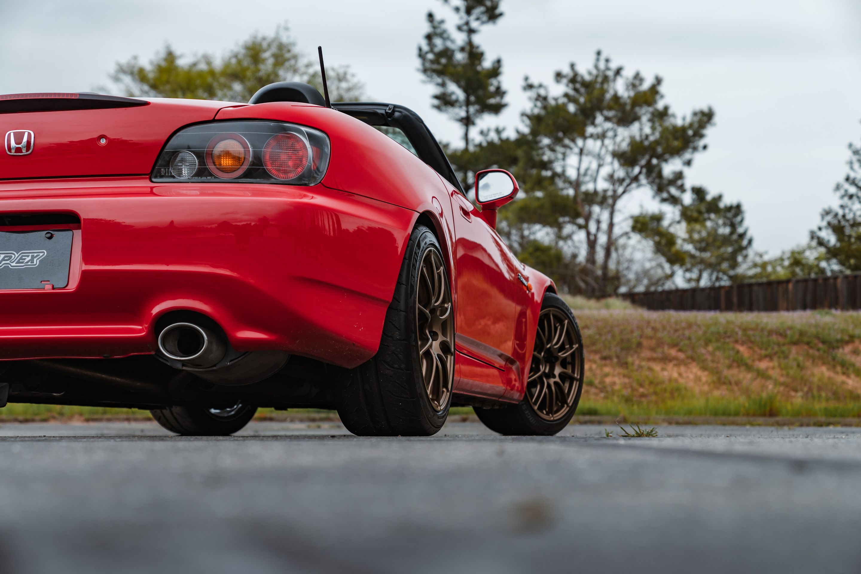 Red Honda S2000 with 17" SM-10RS Apex wheels in Satin Bronze