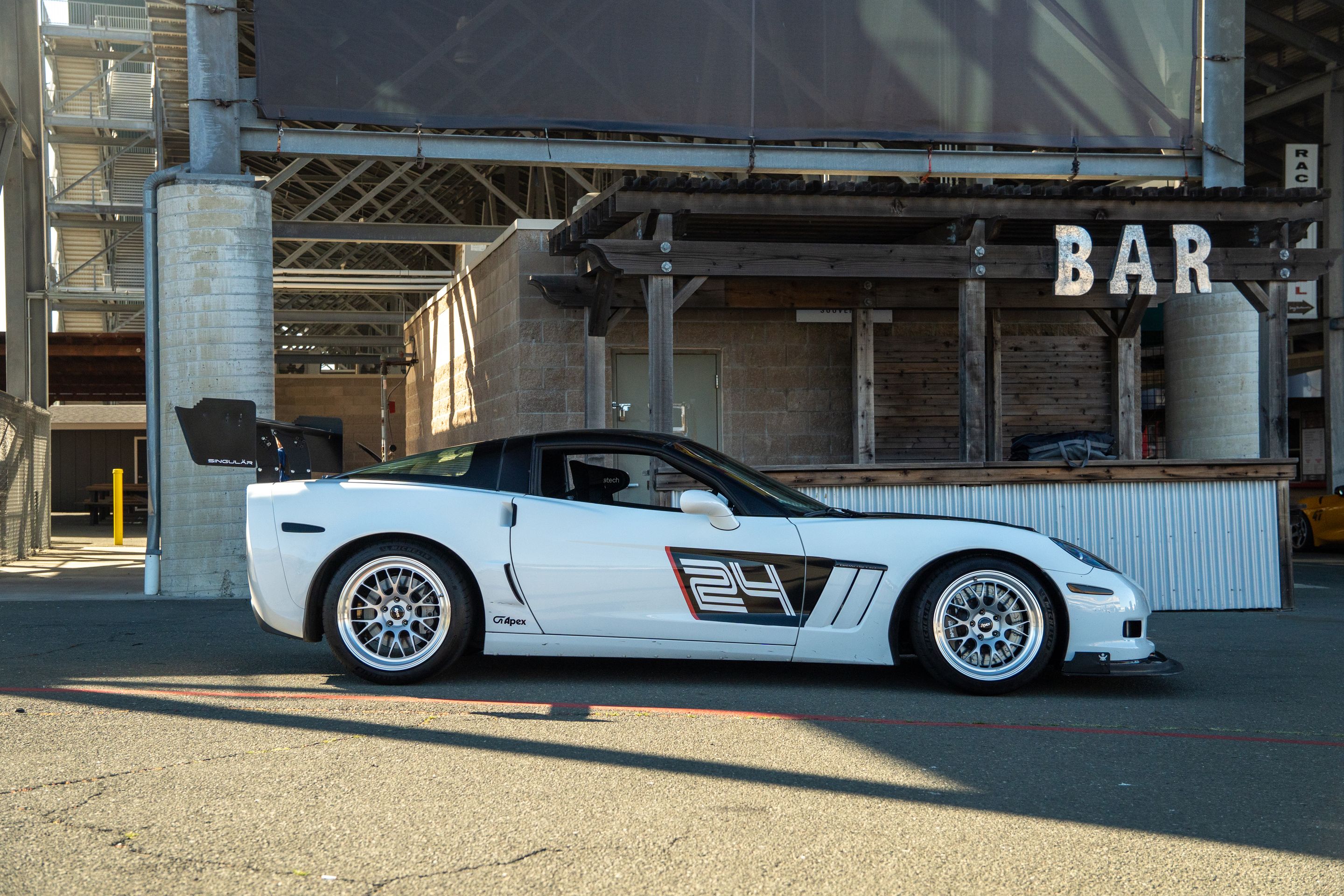 White Chevrolet C6 Corvette Grand Sport with 18"/19" ML-10RT Apex wheels in Machined Lip Race Silver