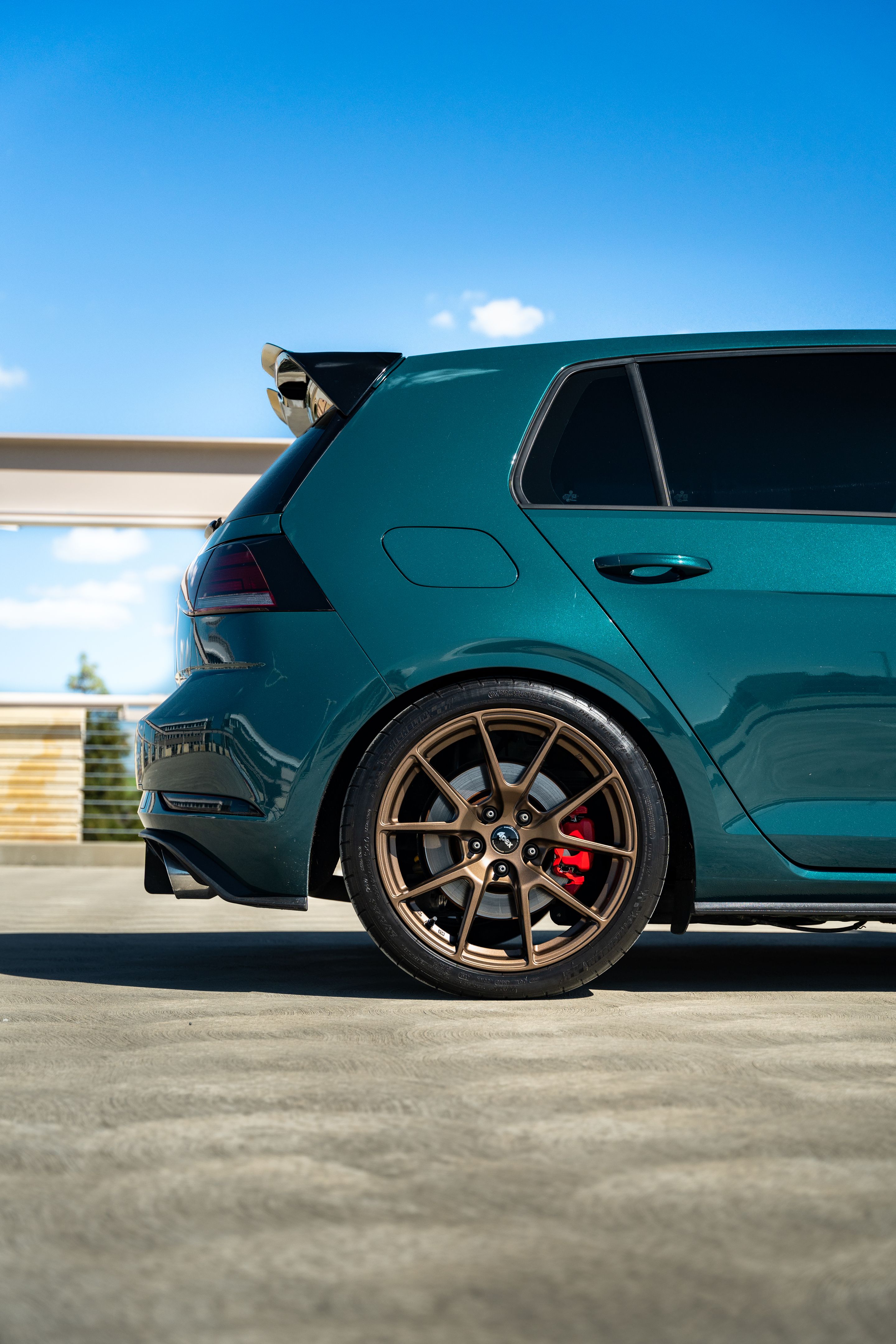 Green VW MK7 GTI with 18" VS-5 Apex wheels in Satin Bronze