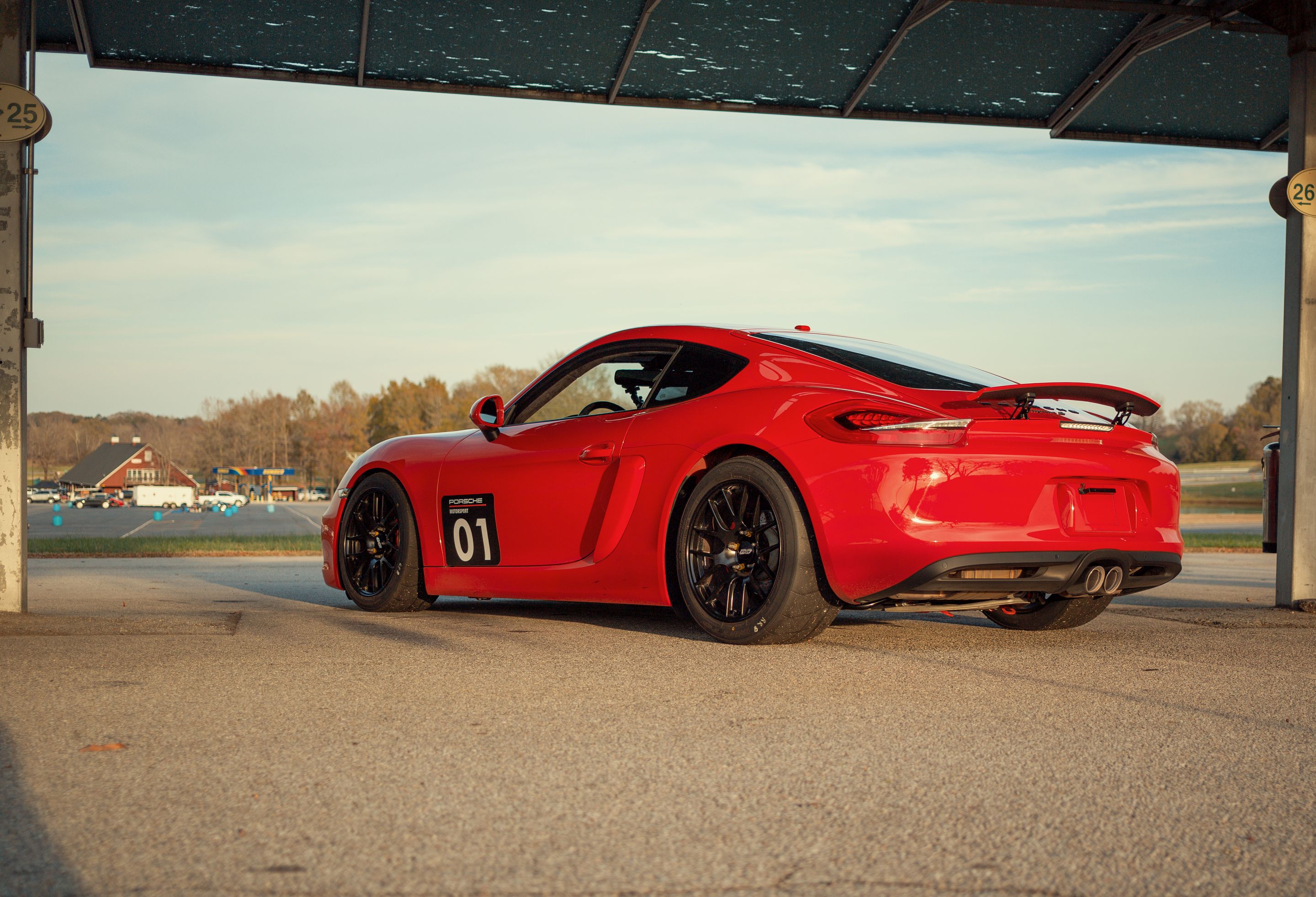 Red Porsche 981 Cayman S with 18" EC-7R Apex wheels in Satin Black