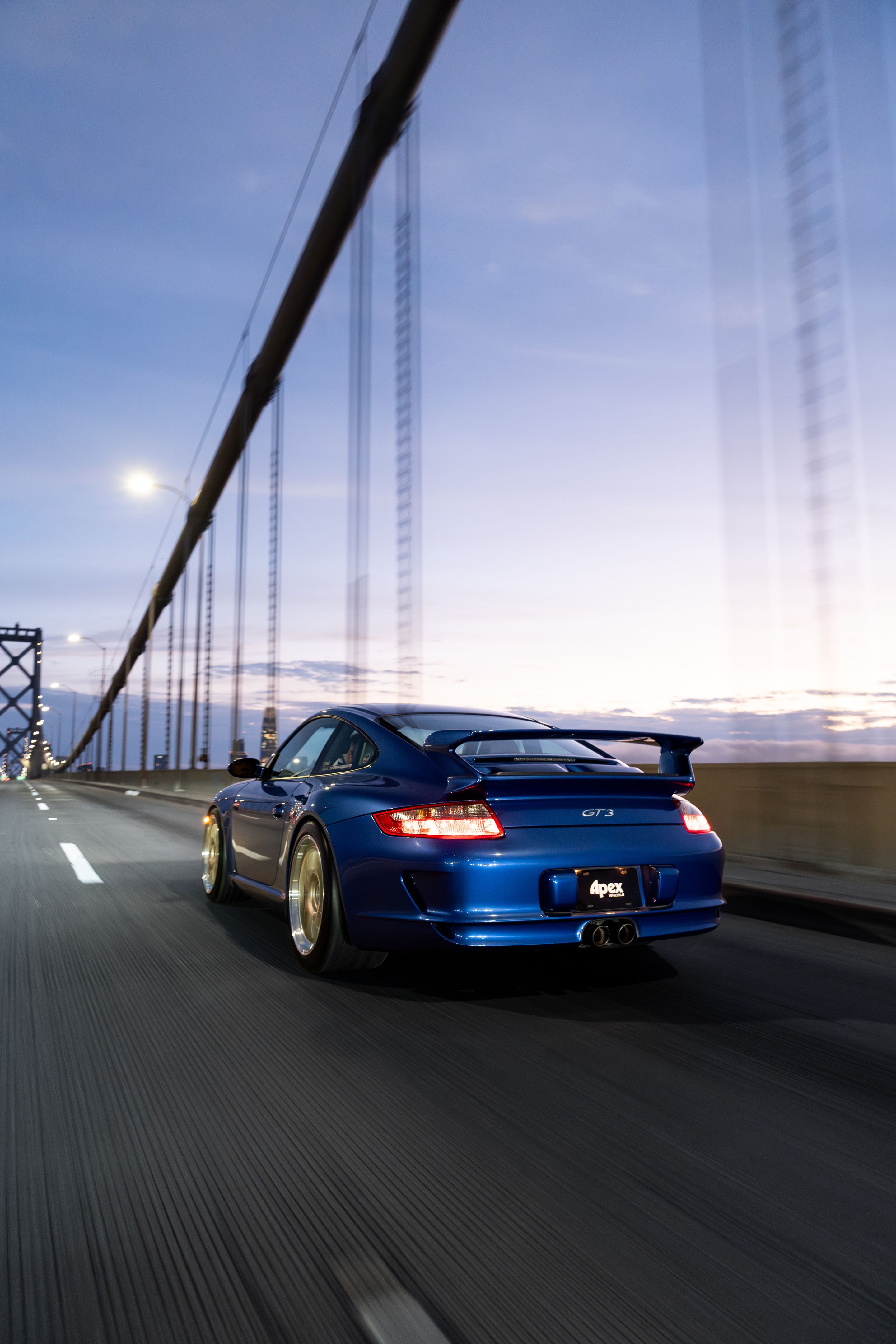 Blue Porsche 911 997 GT3 with 19" TEST-M Apex wheels in Machined Lip Gloss Motorsport Gold