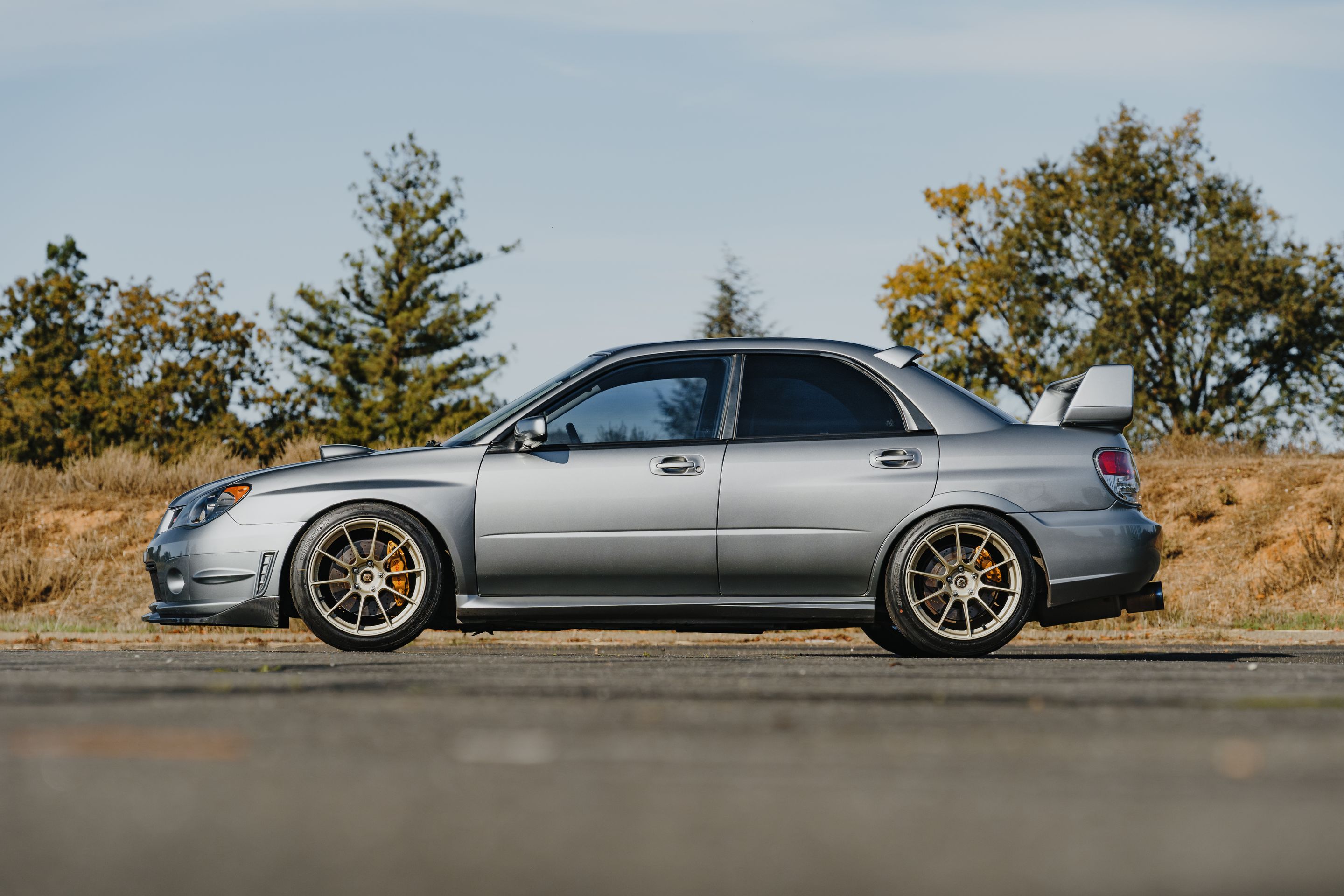 Silver Subaru GD WRX STI with 18" SM-10RS Apex wheels in Motorsport Gold