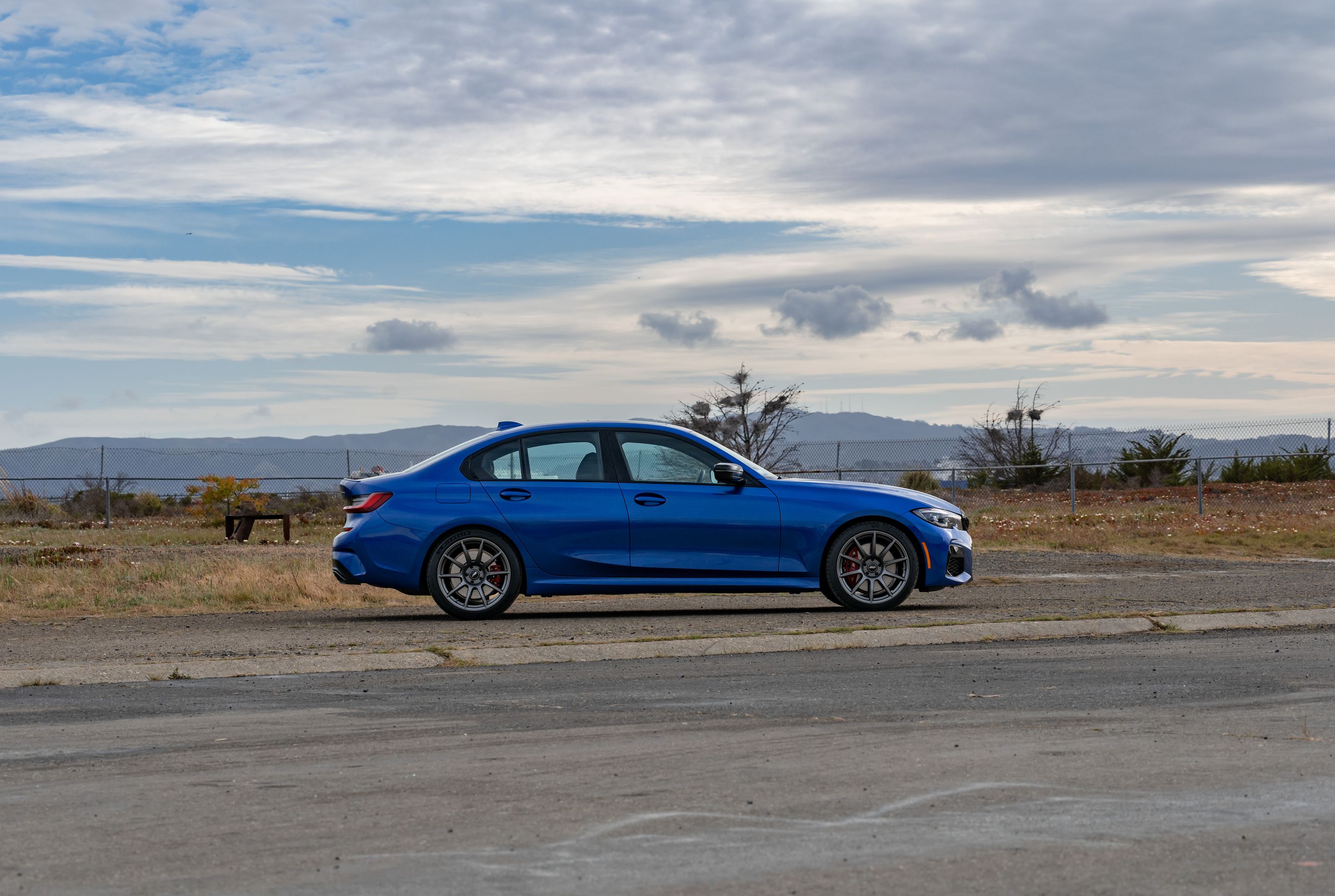 Blue BMW G20 Sedan 3 Series with 19" SM-10 Apex wheels in Anthracite