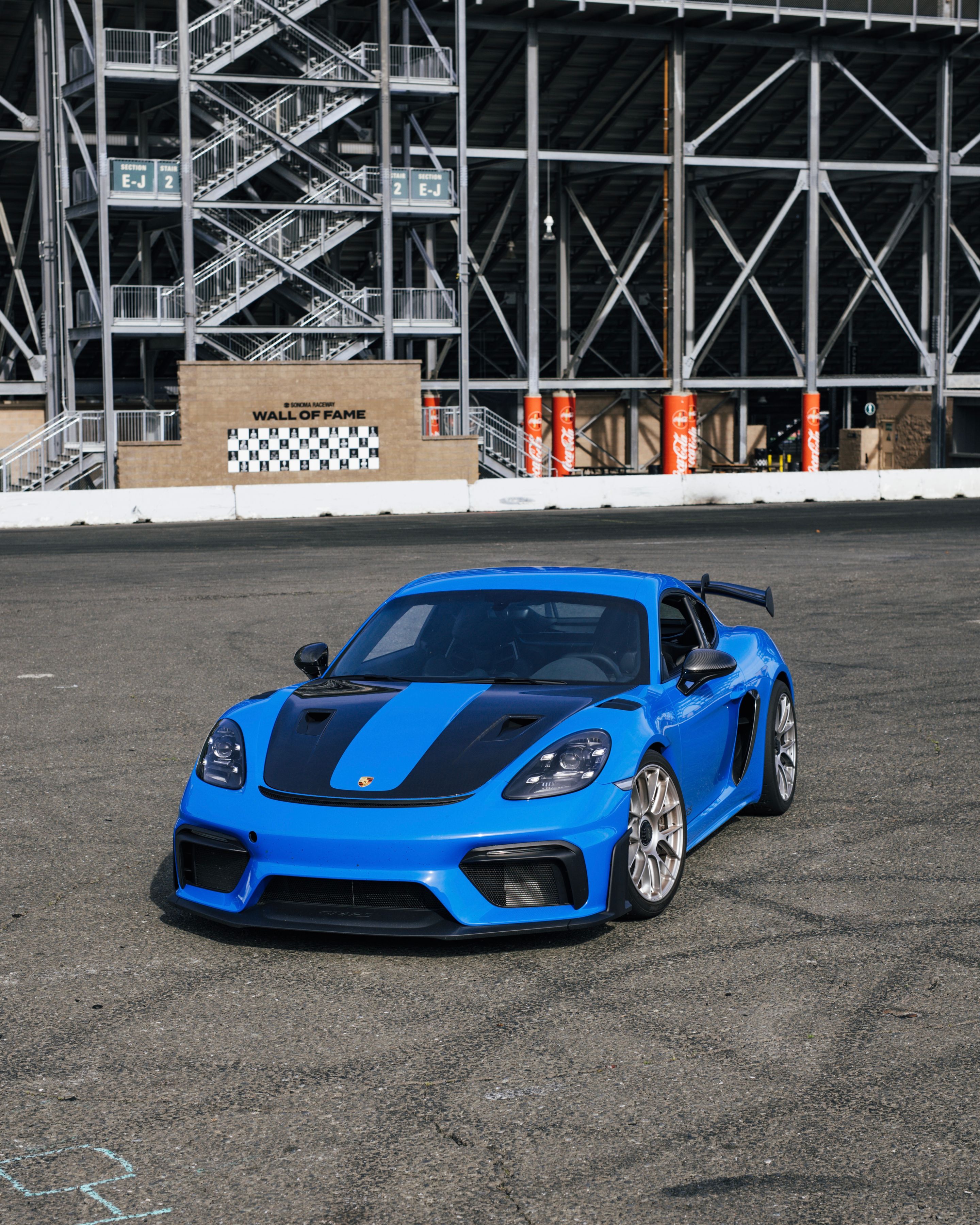 Blue Porsche 718 Cayman GT4 RS with 19" EC-7RS Apex wheels in Race Silver