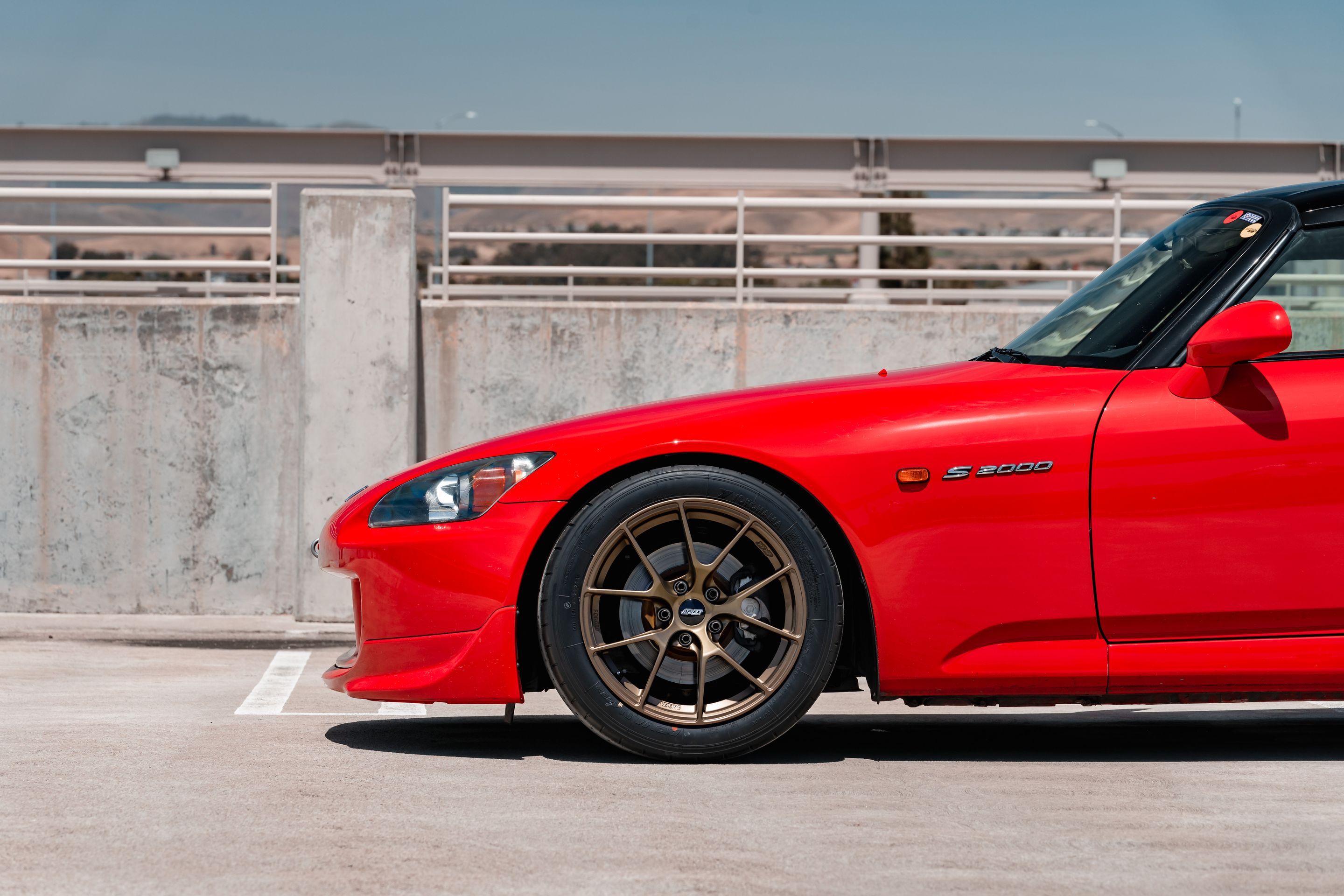 Red Honda S2000 with 17" VS-5RS Apex wheels in Satin Bronze