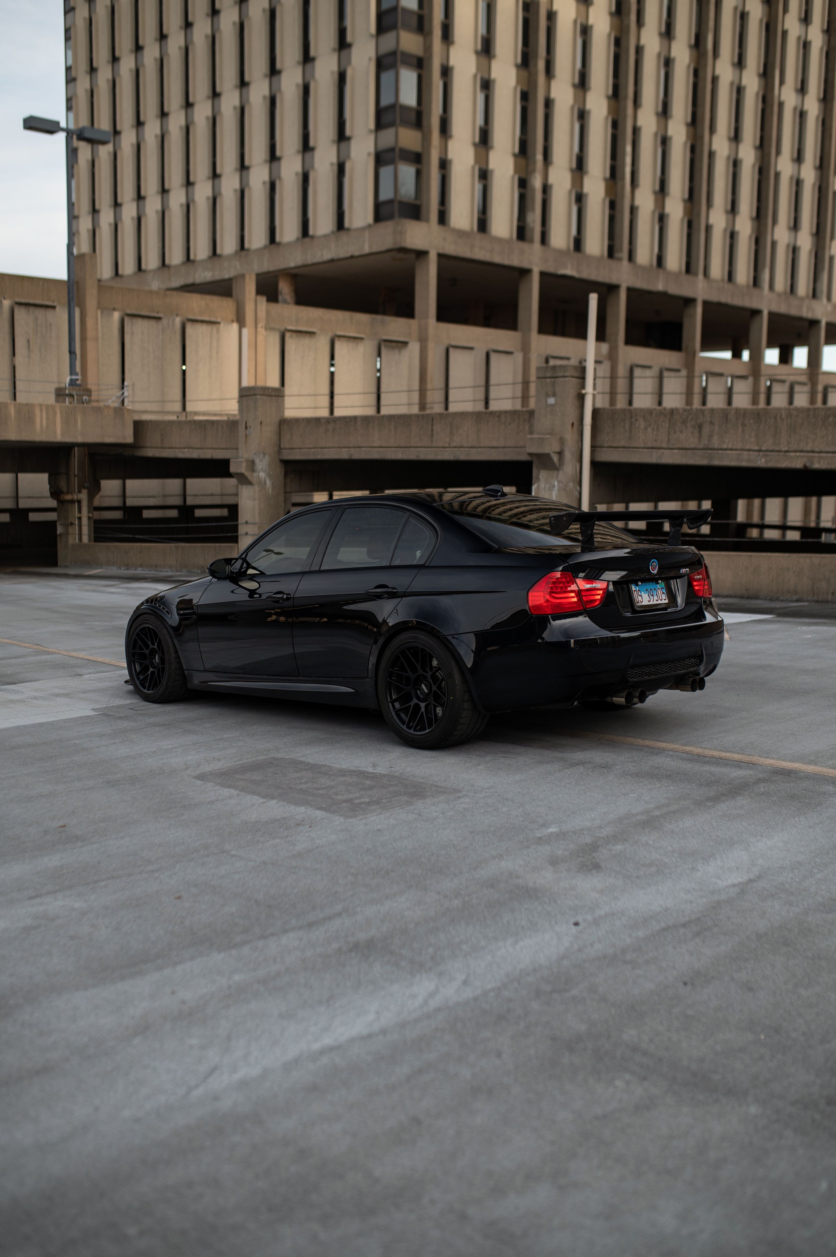 Black BMW E90 Sedan M3 with 18" ARC-8 Apex wheels in Satin Black