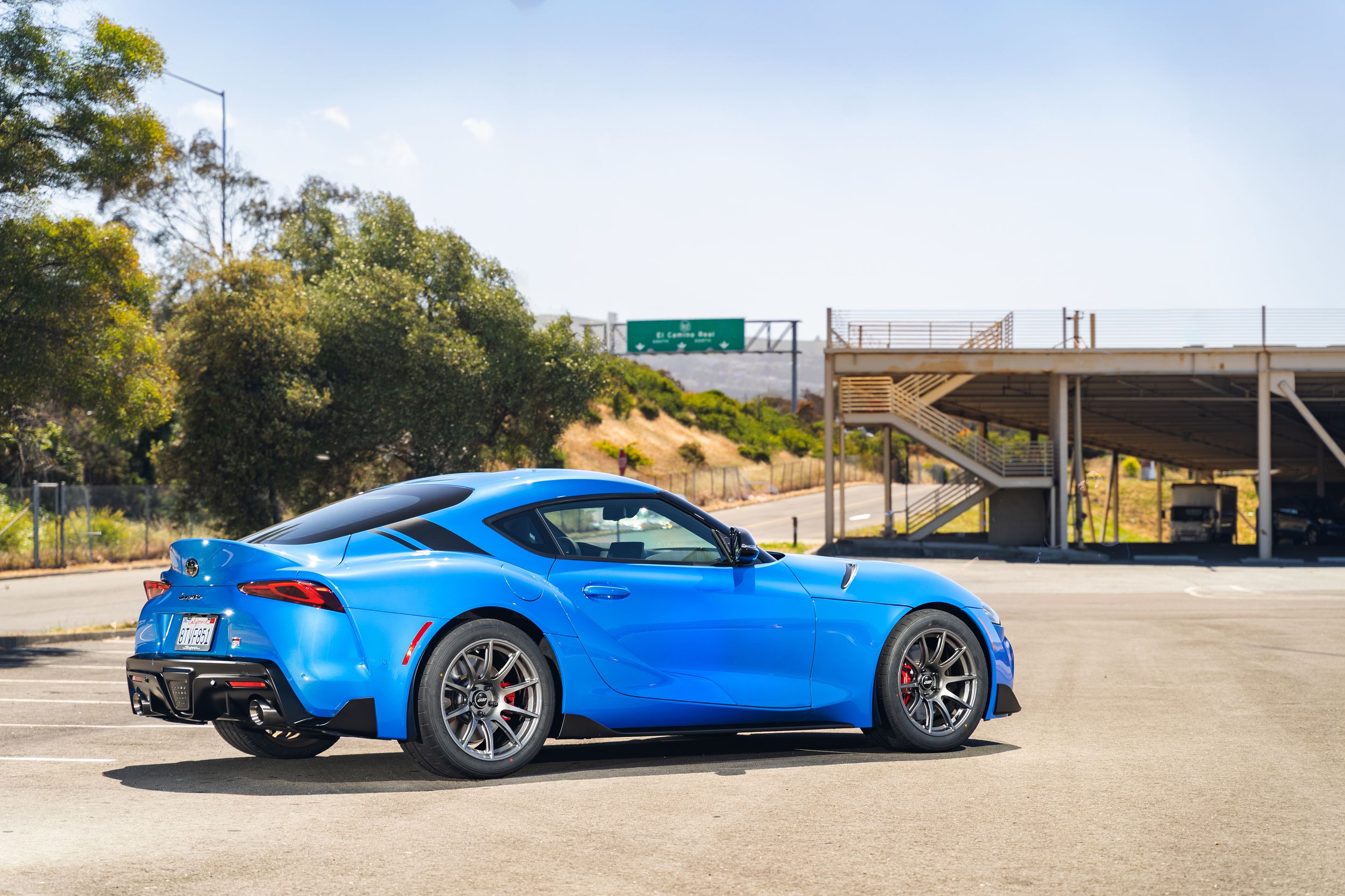 Blue Toyota GR Supra with 18" SM-10 Apex wheels in Anthracite