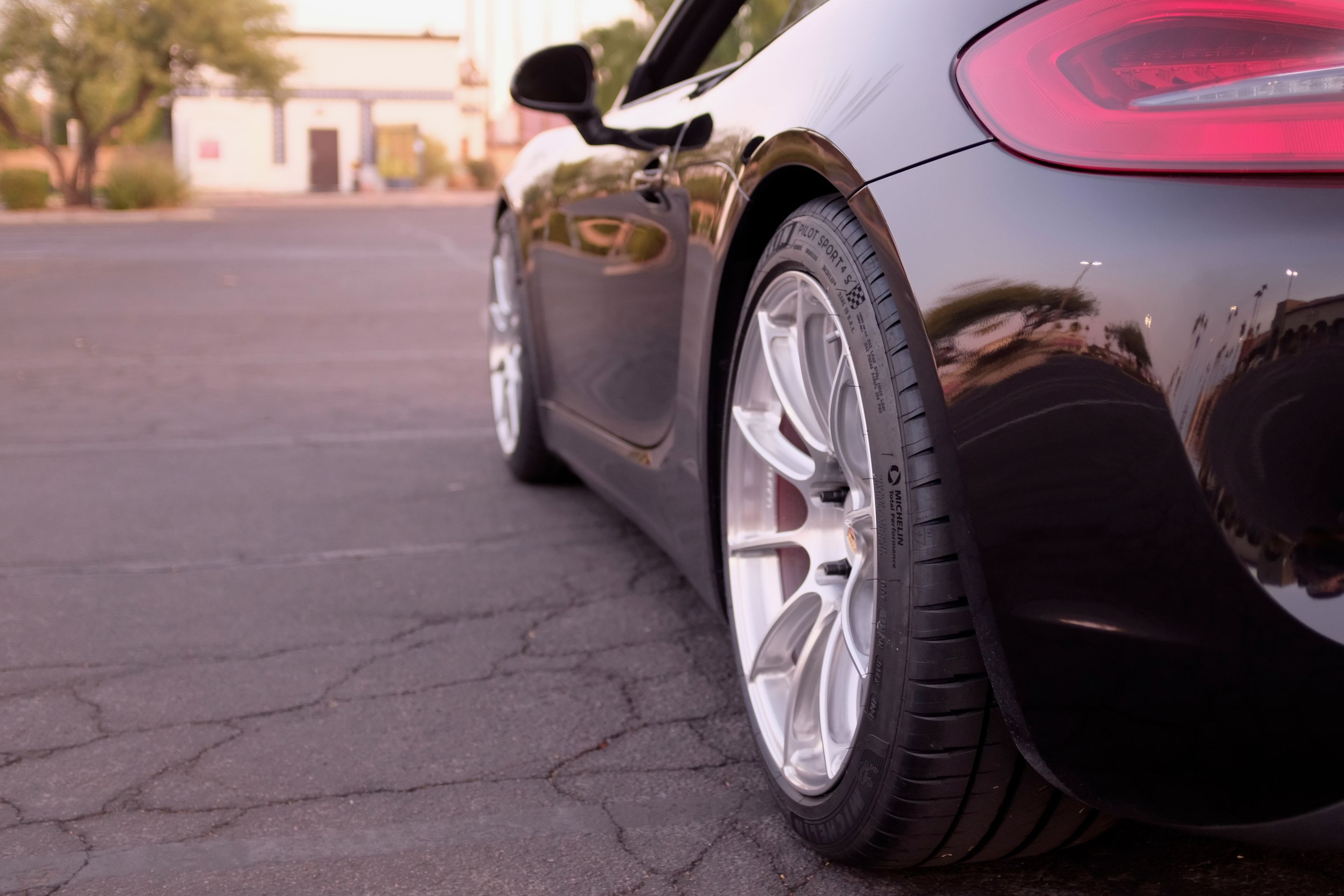 Black Porsche 981 Cayman S with 19" SM-10RS Apex wheels in Brushed Clear