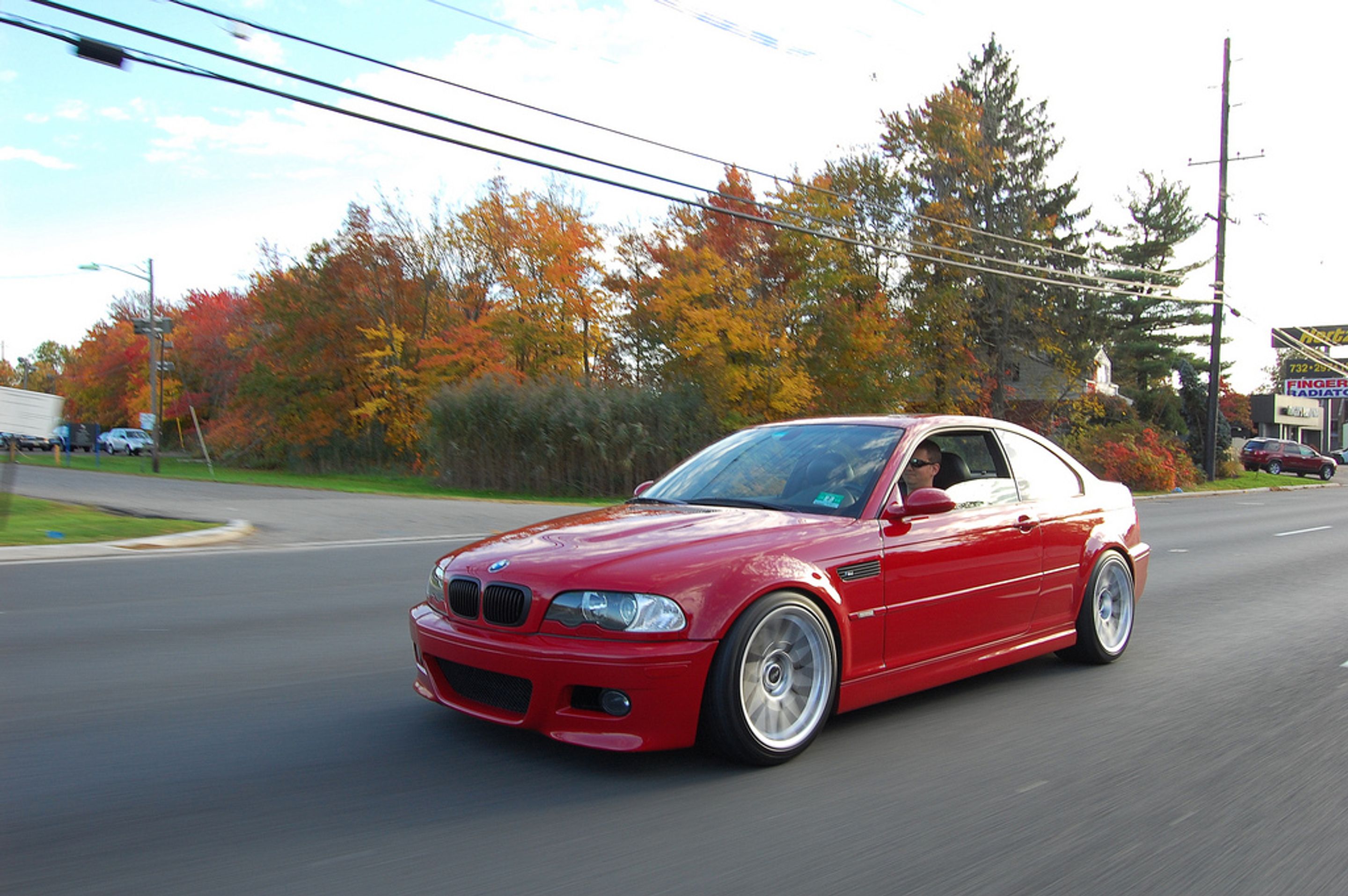 Red BMW E46 M3 with 18" ARC-8 Apex wheels in Hyper Silver