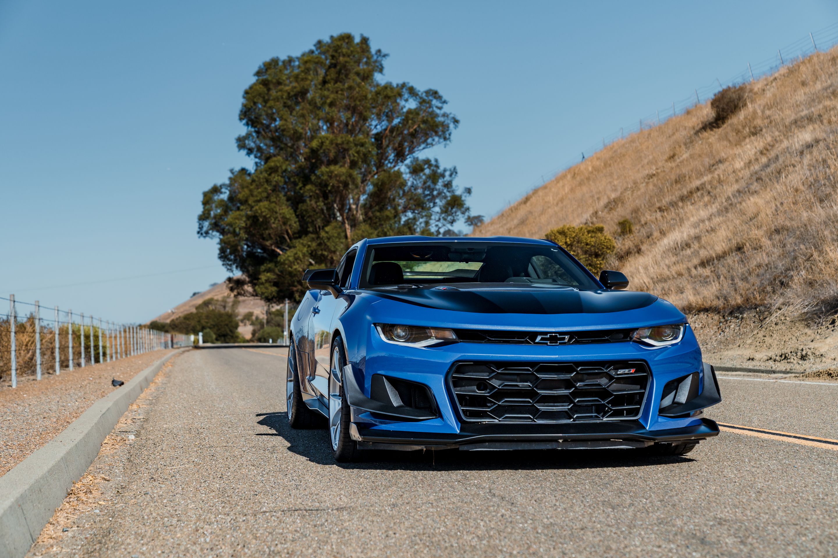 Blue Chevrolet 6th Gen Camaro ZL1 1LE with 20" VS-5RS Apex wheels in Brushed Clear