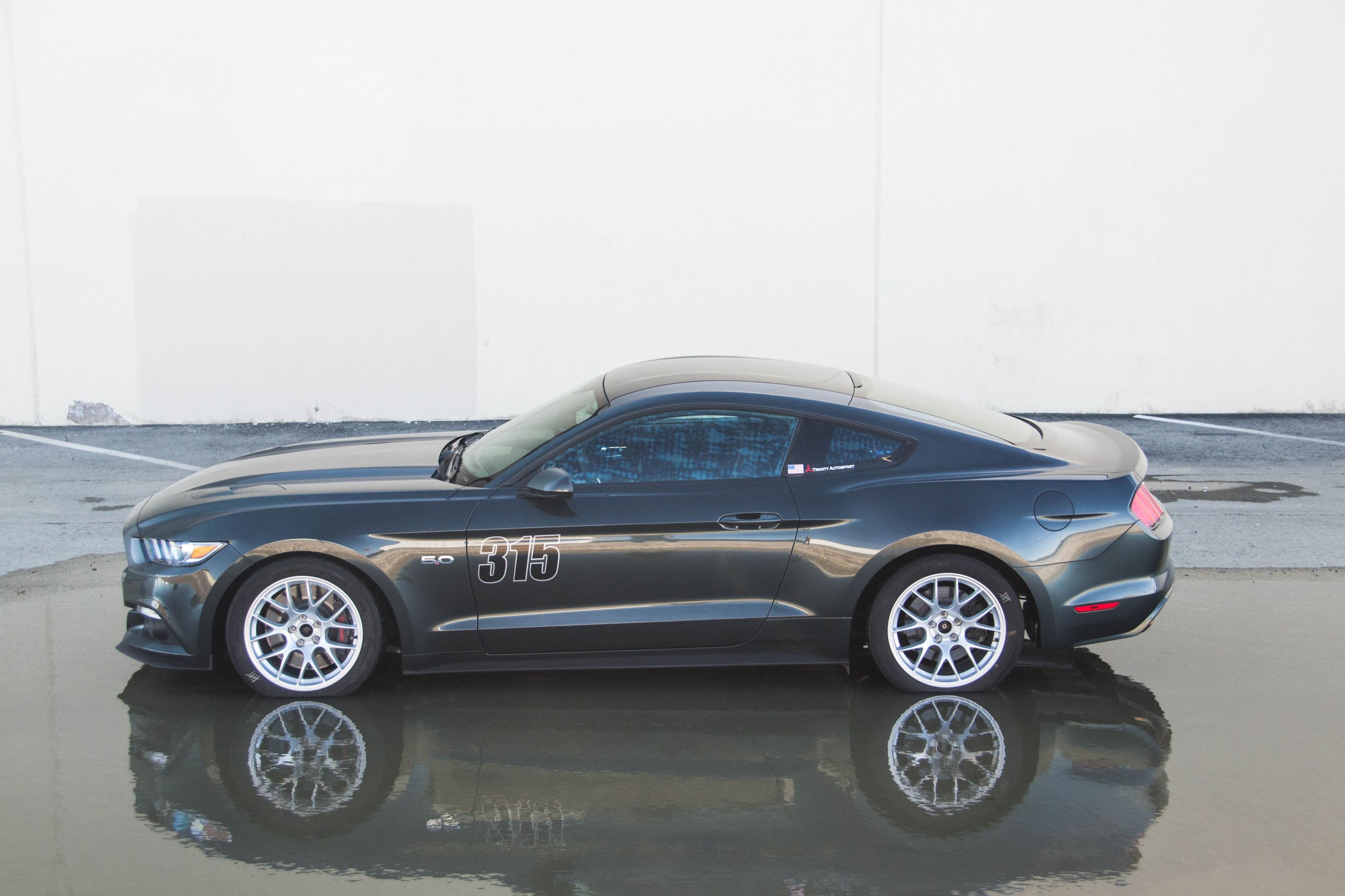 Green Ford S550 Mustang GT with 18" EC-7 Apex wheels in Race Silver