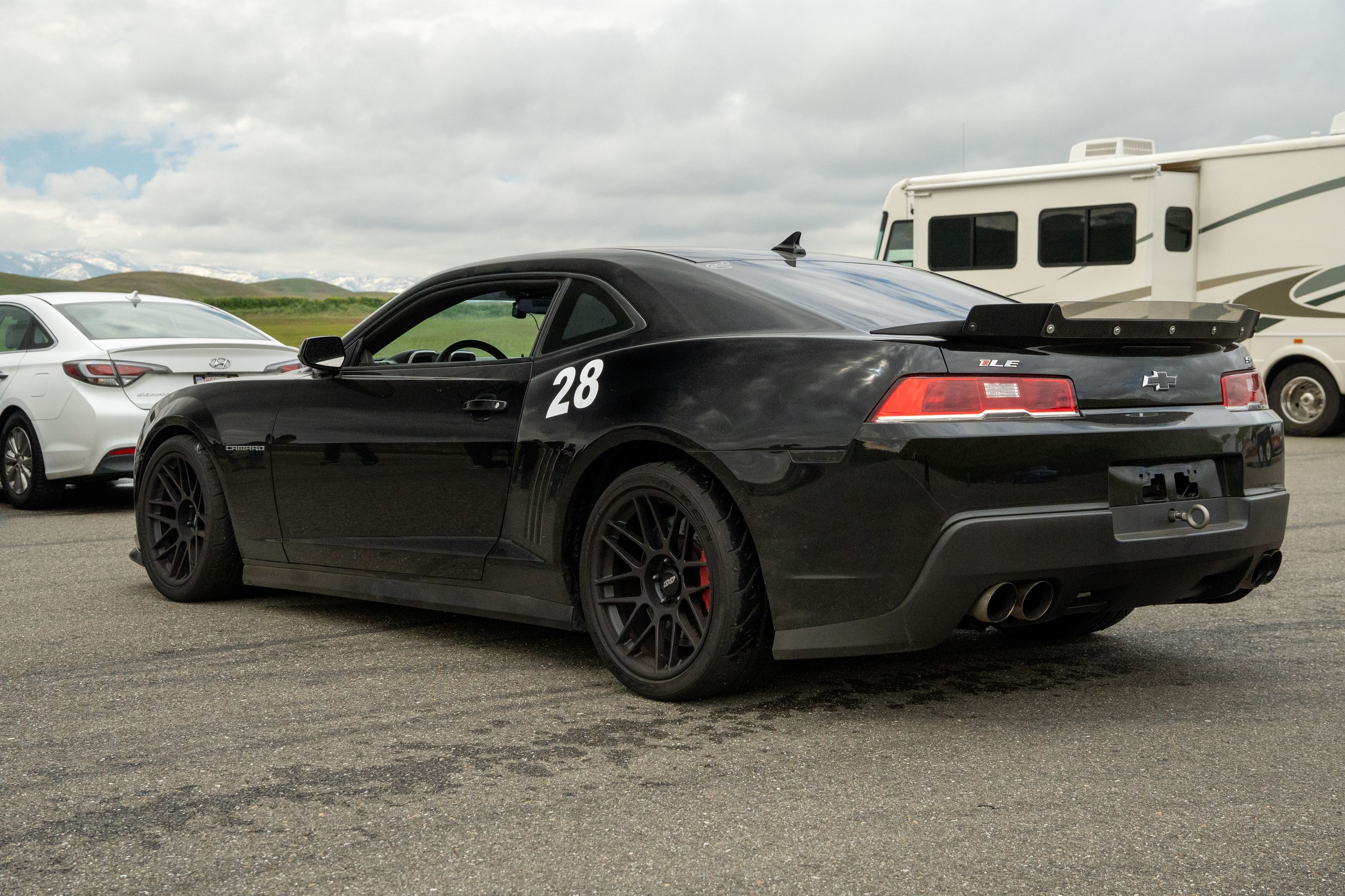 Black Chevrolet 5th Gen Camaro SS with 19" ARC-8 Apex wheels in Satin Black