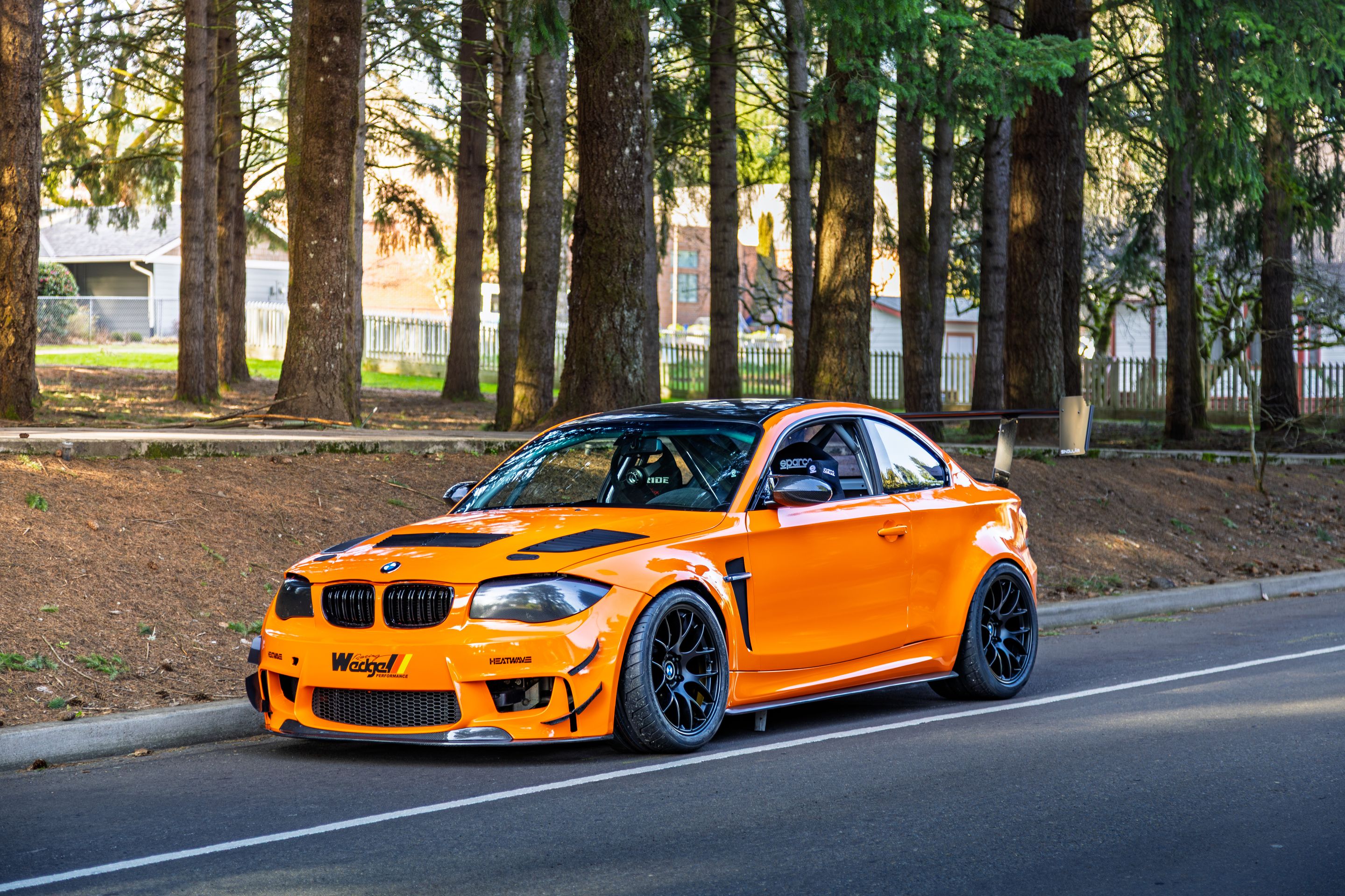 Orange BMW E82 1M with 18" EC-7 Apex wheels in Satin Black