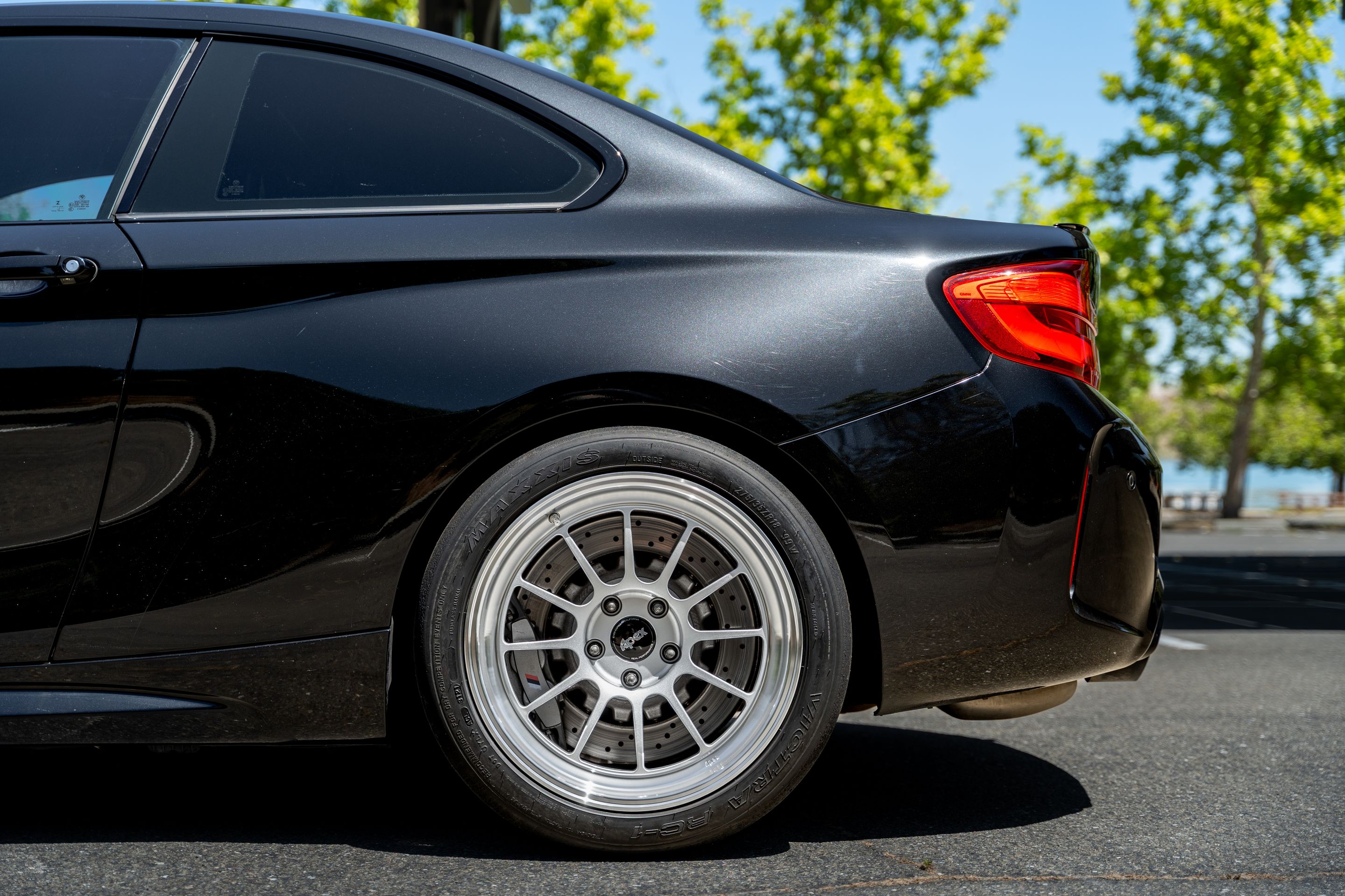 Black BMW F87 M2 with 18" SL-12RT Apex wheels in Machined Lip Race Silver