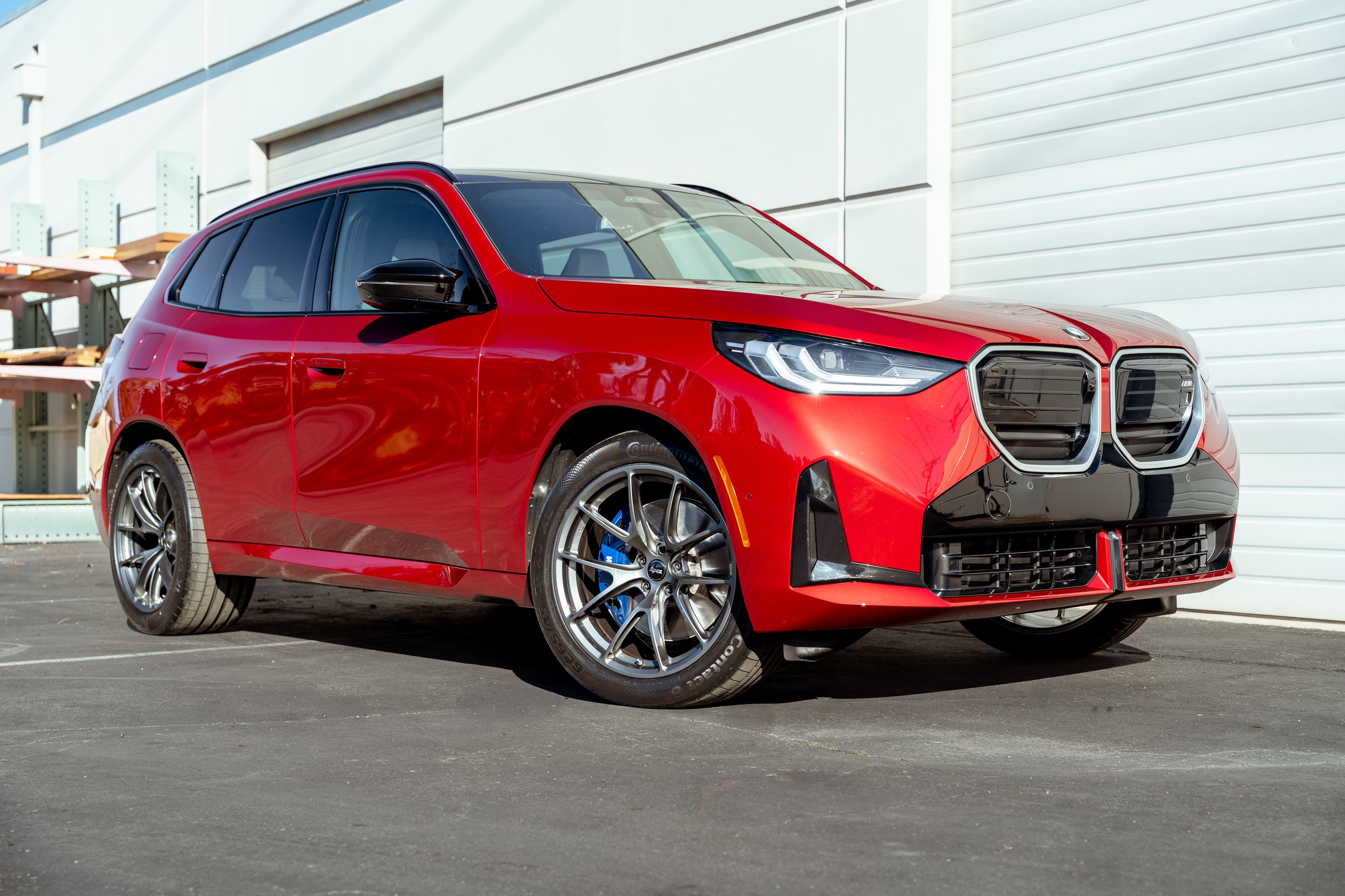 Red BMW G45 X3 with 20" VS-5RX Apex wheels in Anthracite