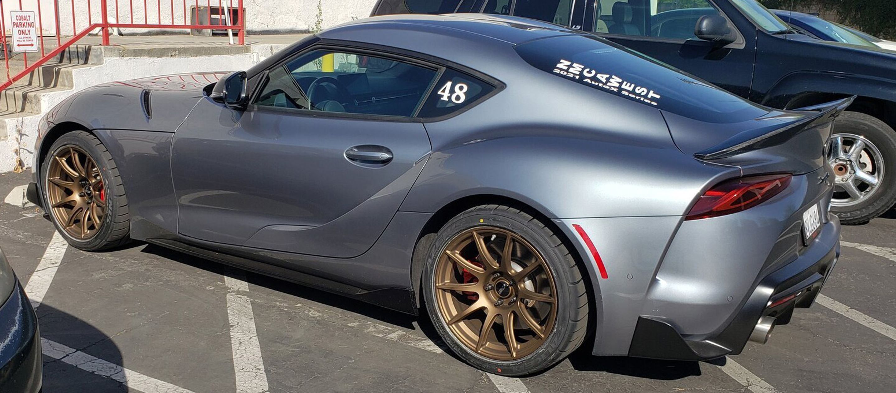 Grey Toyota GR Supra with 18" SM-10 Apex wheels in Satin Bronze