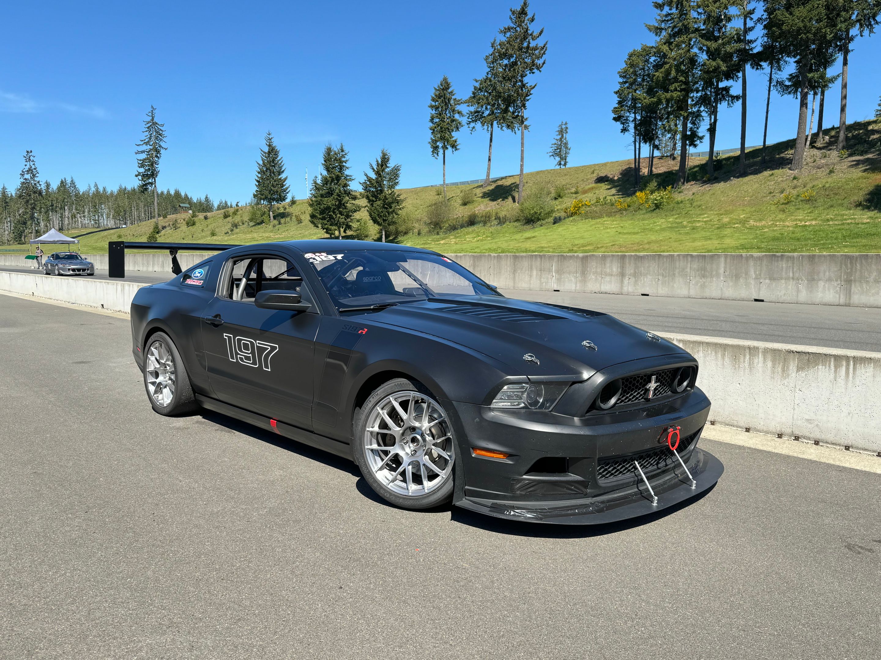 Black Ford S197 Mustang GT with 18" EC-7RS Apex wheels in Brushed Clear