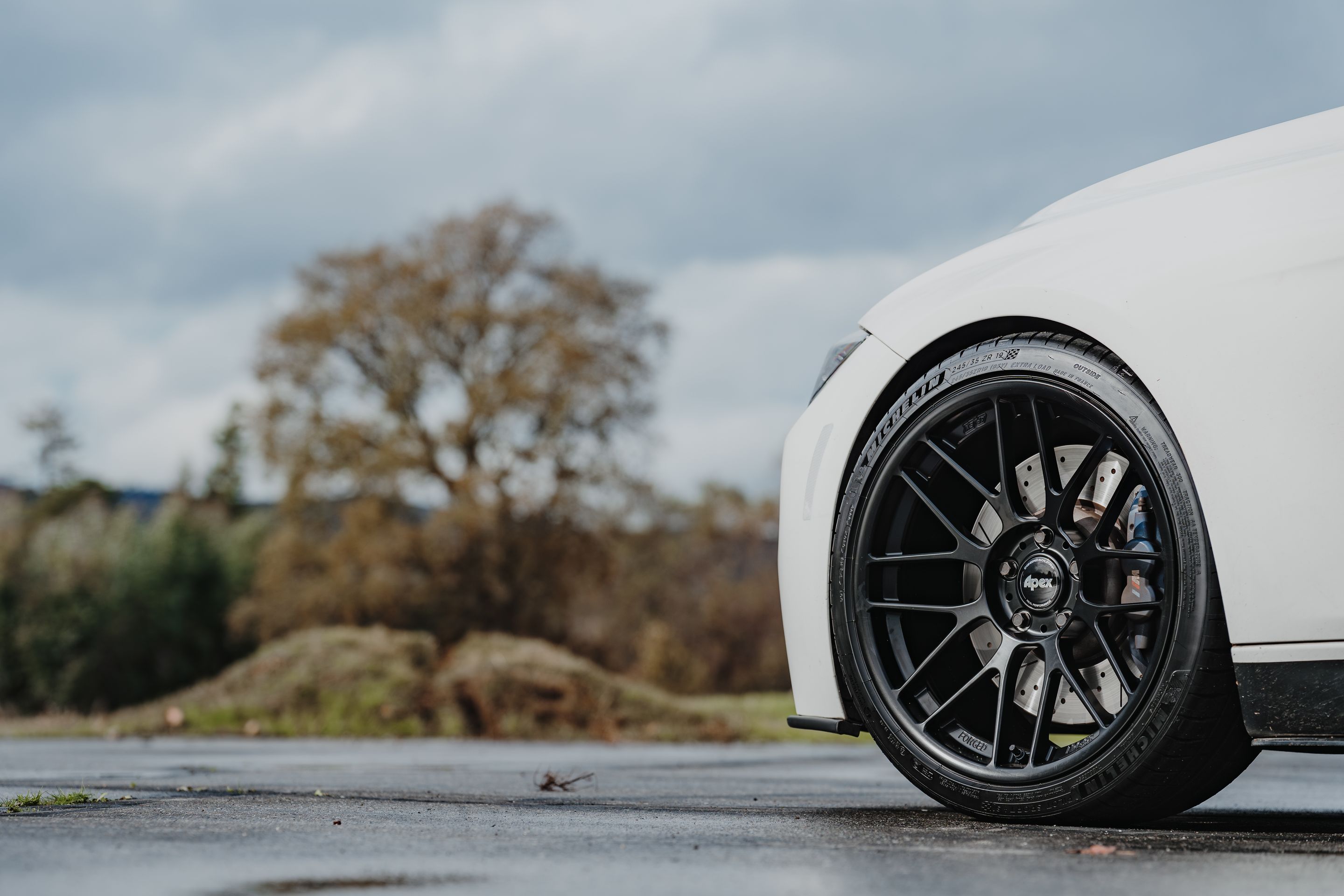 White BMW F31 Wagon 3 Series with 19" ARC-8RT Apex wheels in Satin Black