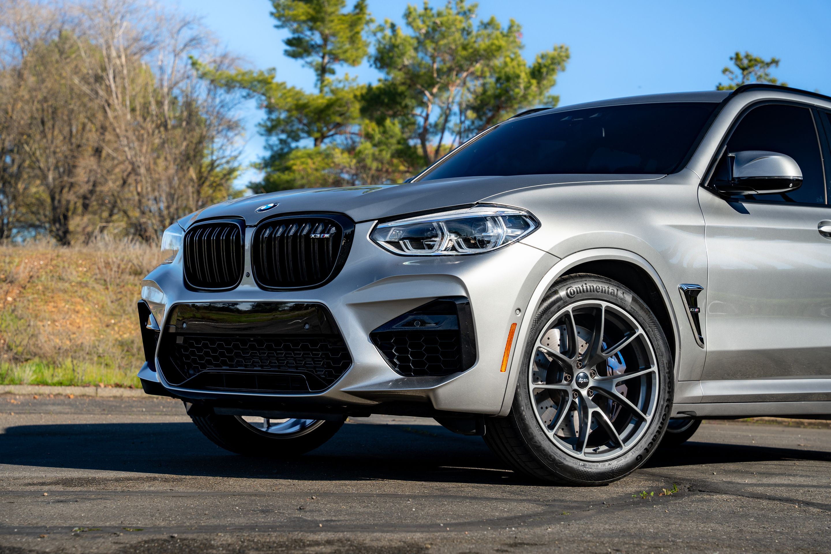 Silver BMW F97 X3M with 20" VS-5RX Apex wheels in Anthracite