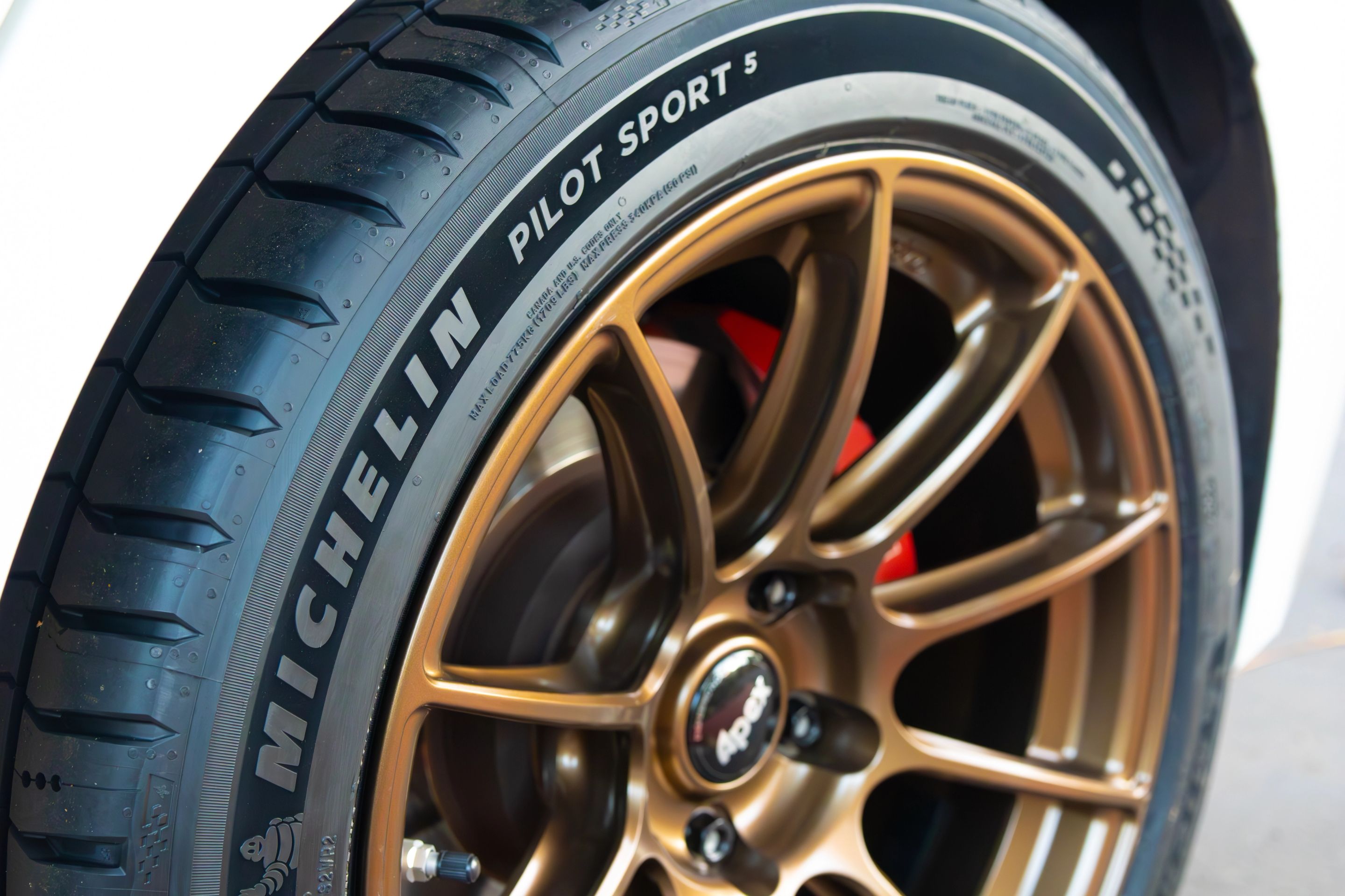 White Toyota GR Corolla with 17" SM-10RS Apex wheels in Satin Bronze