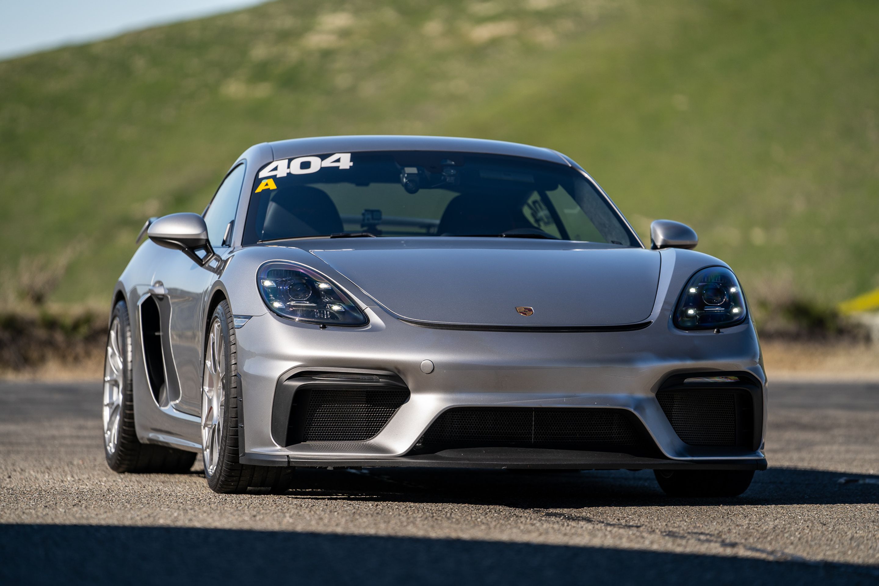 Grey Porsche 718 Cayman GT4 with 19" EC-7RS Apex wheels in Race Silver