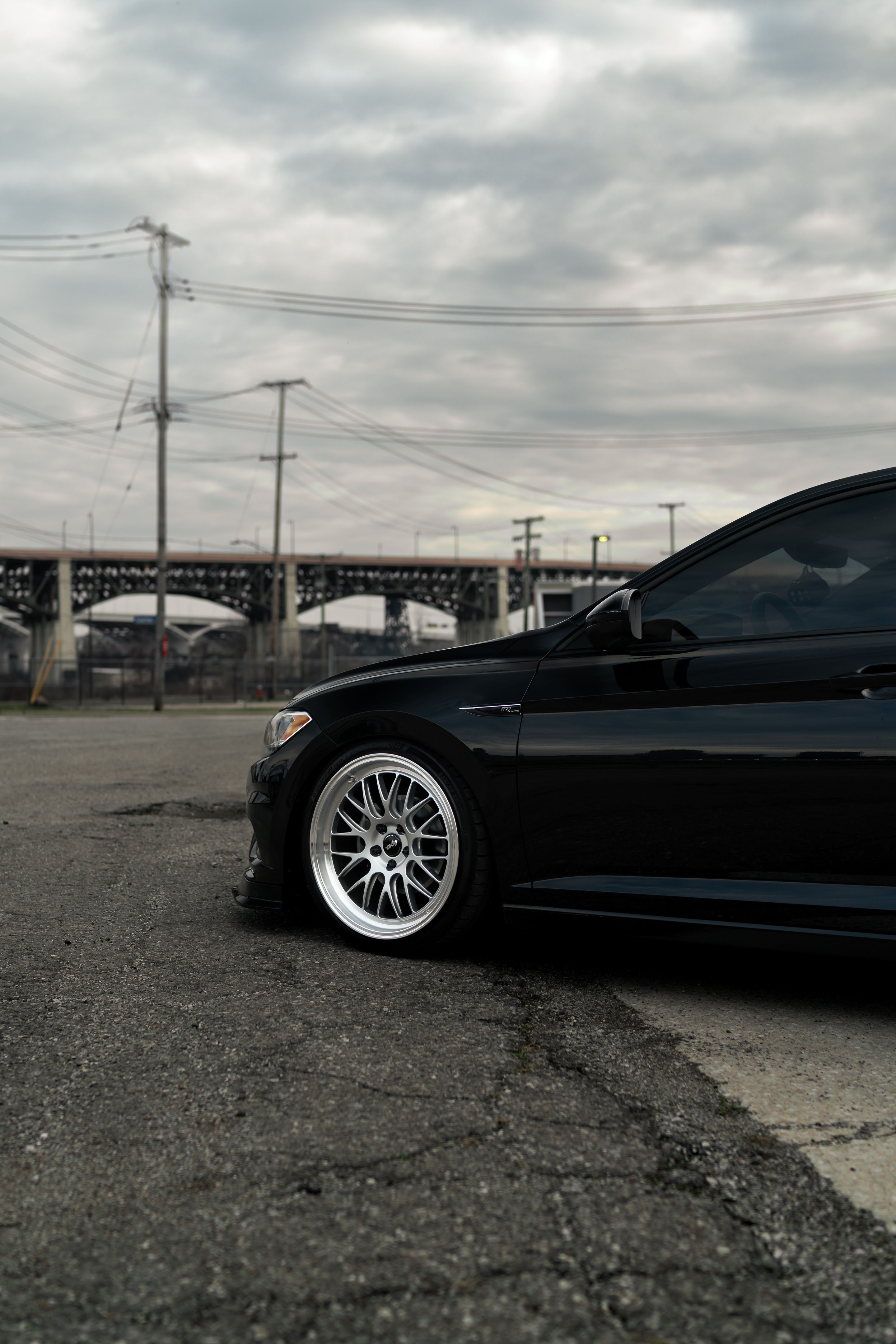 Black VW MK7 Jetta with 19" ML-10RT Apex wheels in Machined Lip Race Silver
