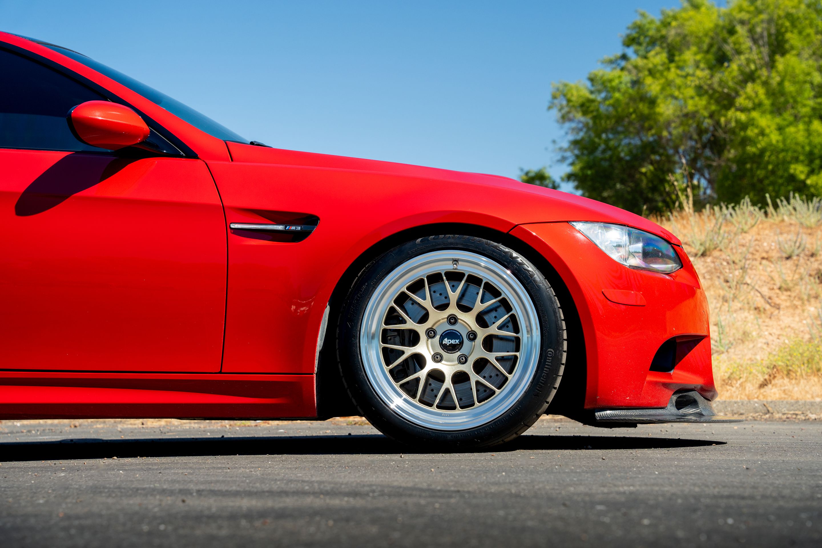 Red BMW E92 Coupe M3 with 18" ML-10RT Apex wheels in Machined Lip Gloss Motorsport Gold