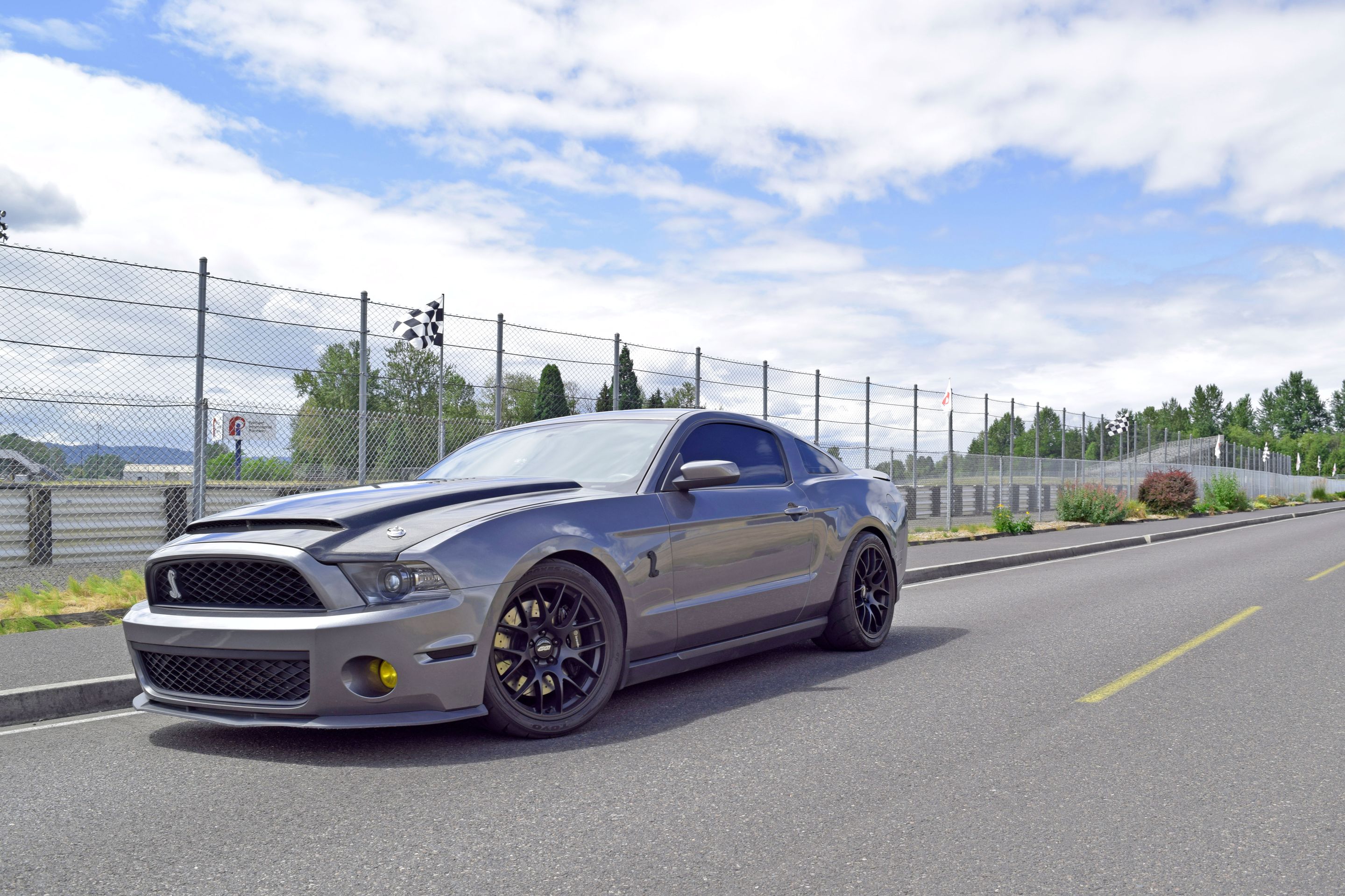 Grey Ford S197 Mustang GT500 with 19" EC-7 Apex wheels in Satin Black