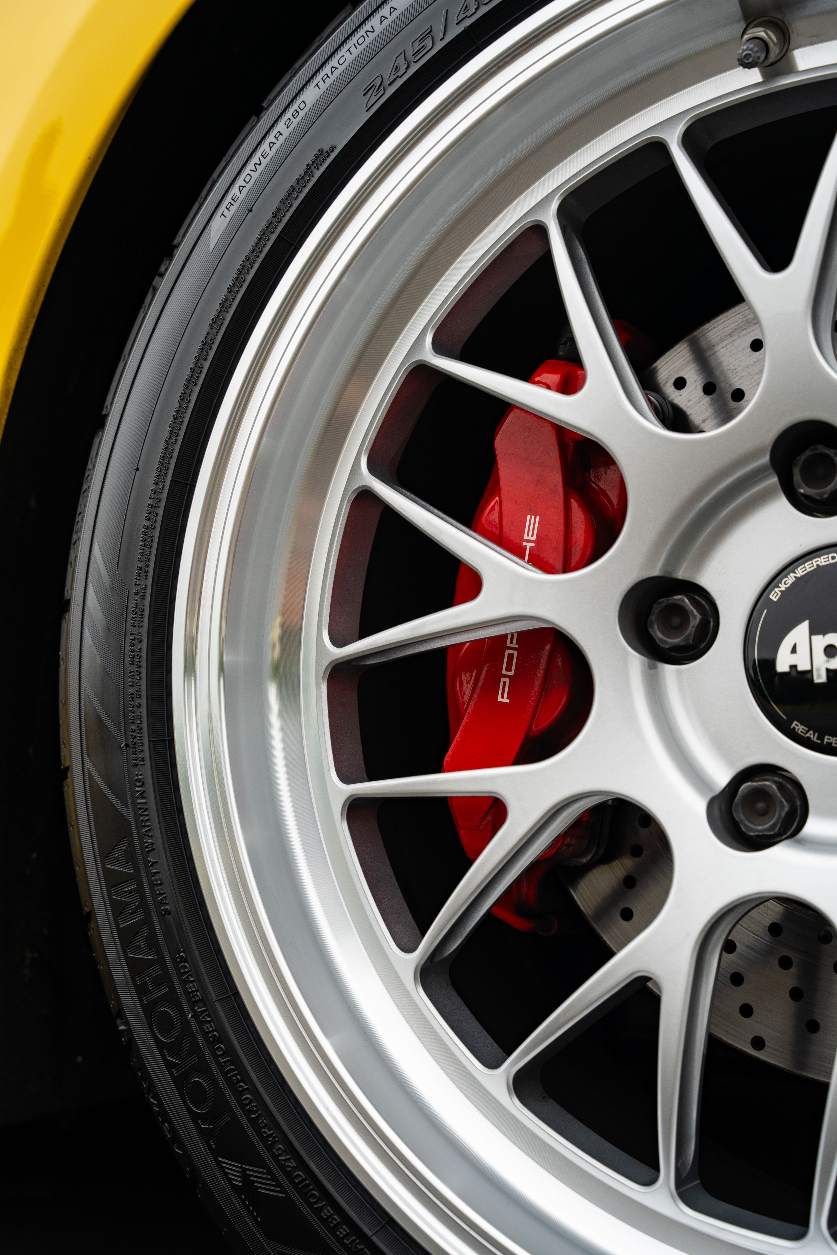 Yellow Porsche 981 Cayman GTS with 19" ML-10RT Apex wheels in Machined Lip Race Silver