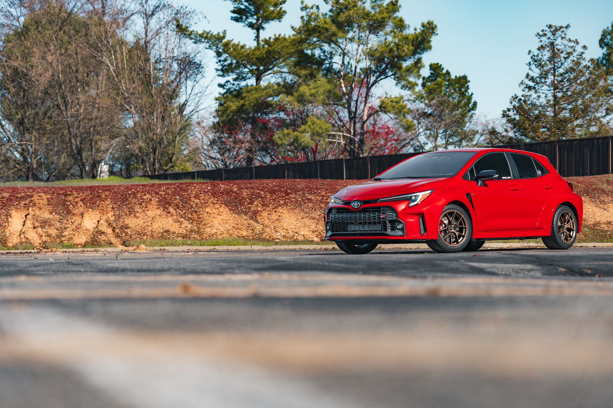 Red Toyota GR Corolla with 17" VS-5RS Apex wheels in Satin Bronze