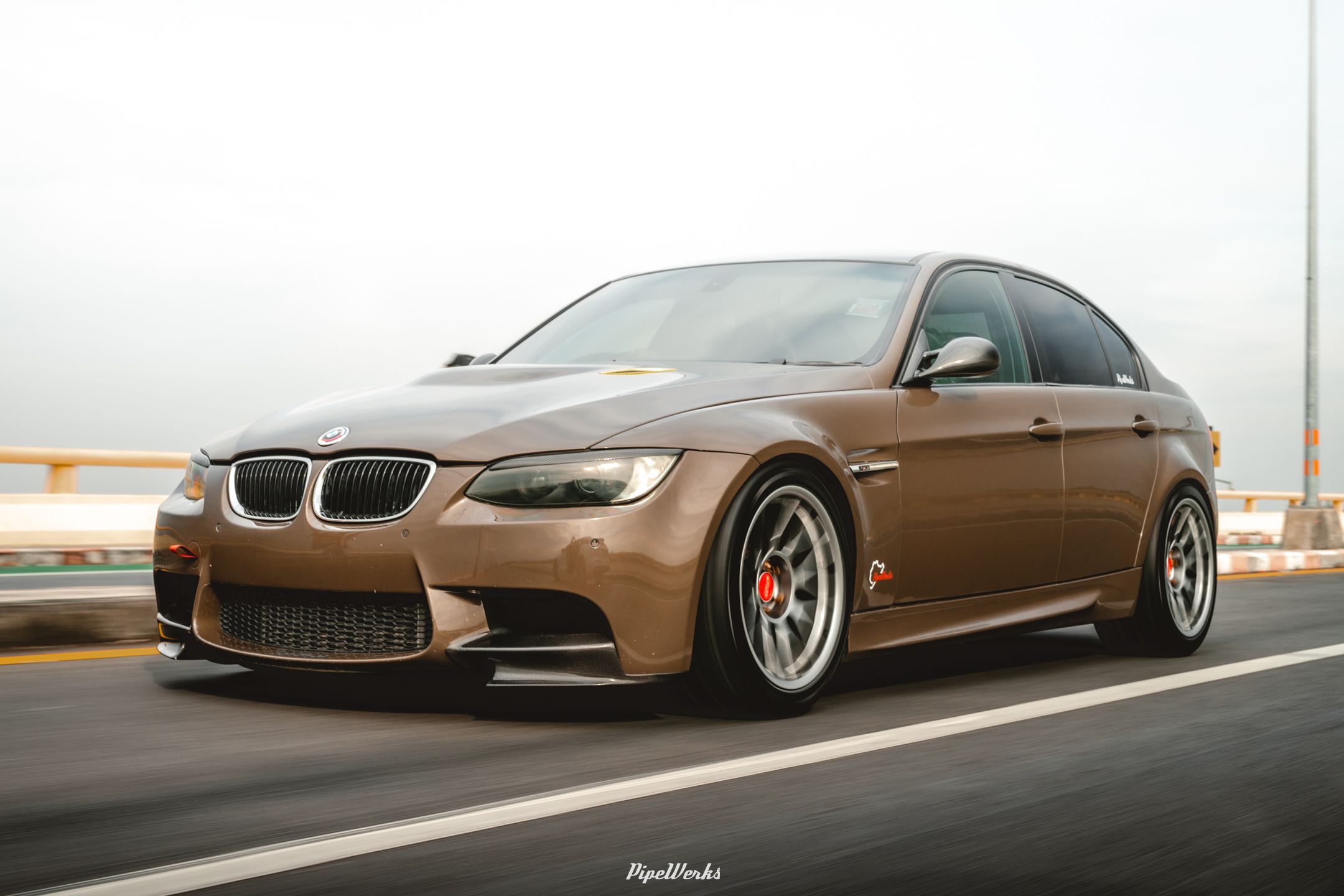 Brown BMW E90 Sedan 3 Series with 18" ARC-8 Apex wheels in Hyper Black