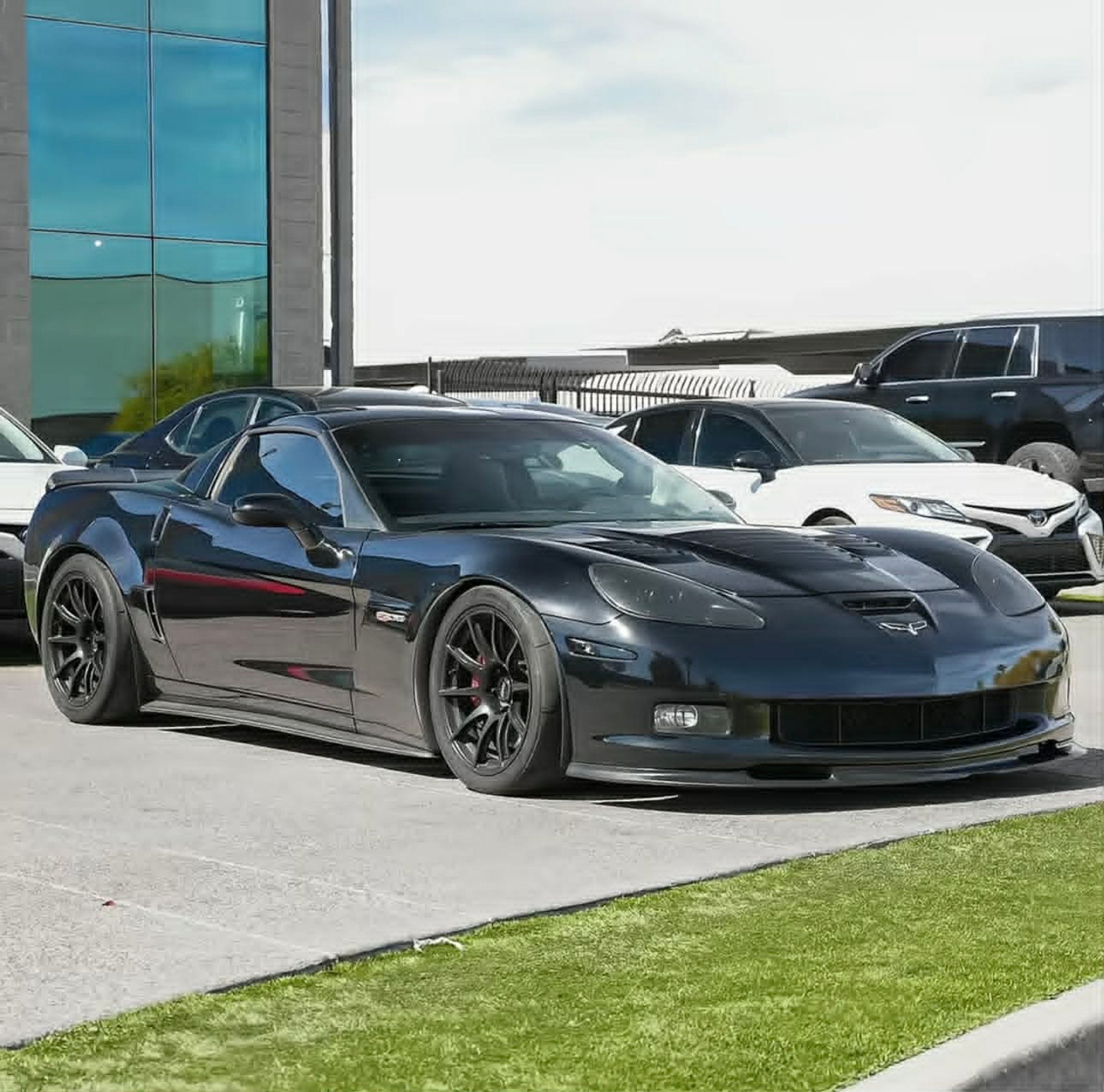 Black Chevrolet C6 Corvette Z06 with 18" SM-10 Apex wheels in Satin Black