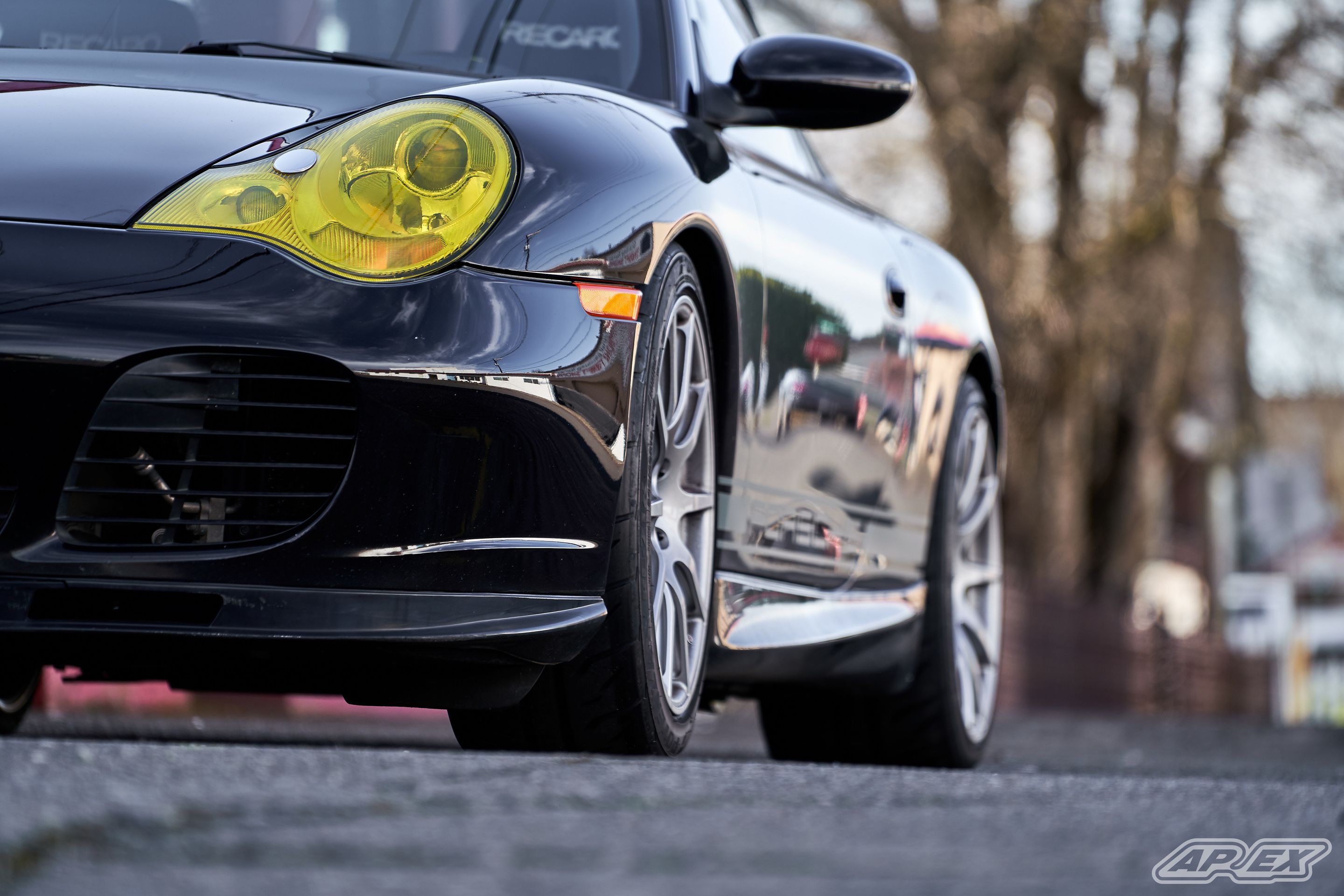 Black Porsche 911 996 Carrera with 18" SM-10 Apex wheels in Race Silver