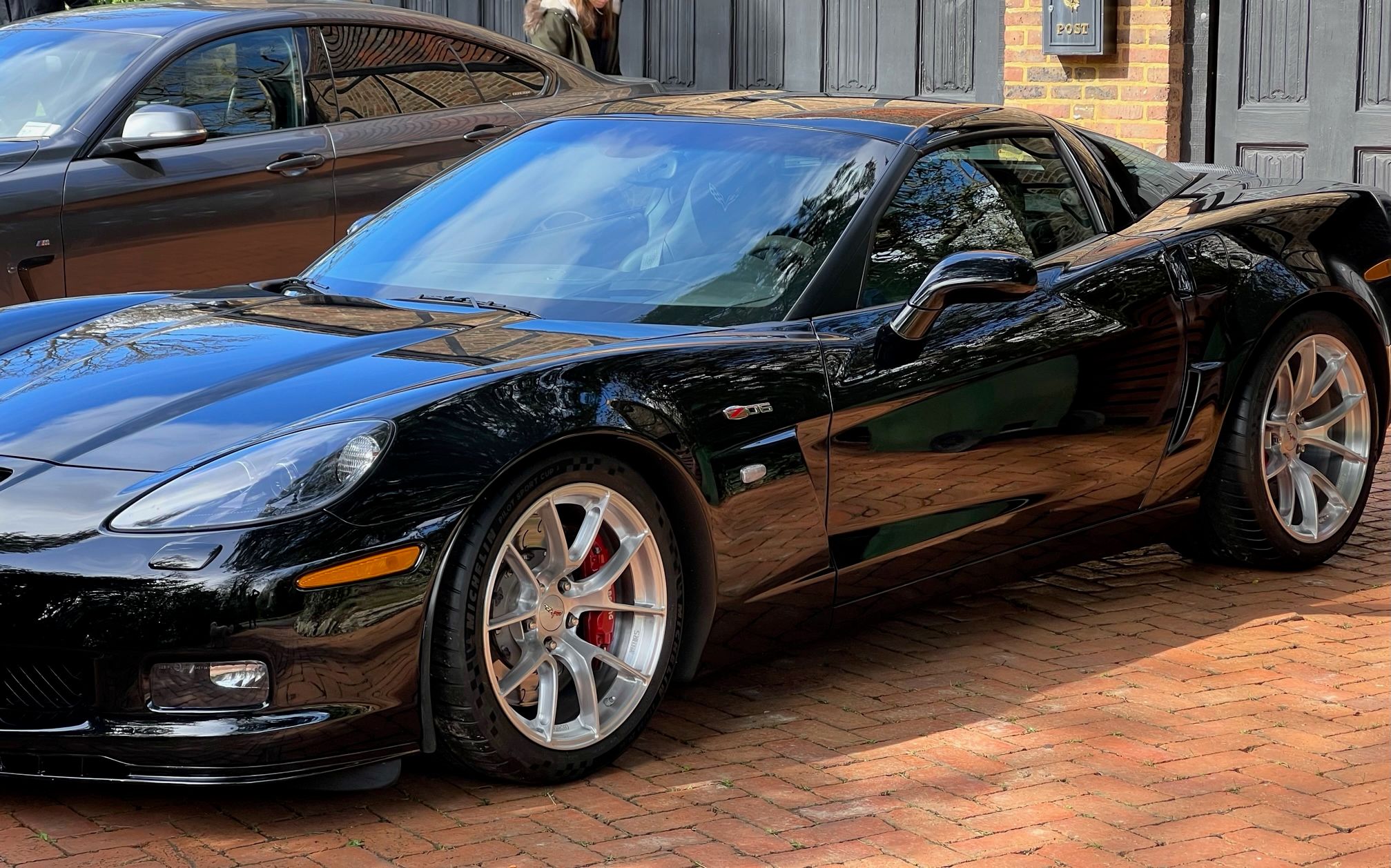 Black Chevrolet C6 Corvette Z06 with 18"/19" VS-5RS Apex wheels in Brushed Clear