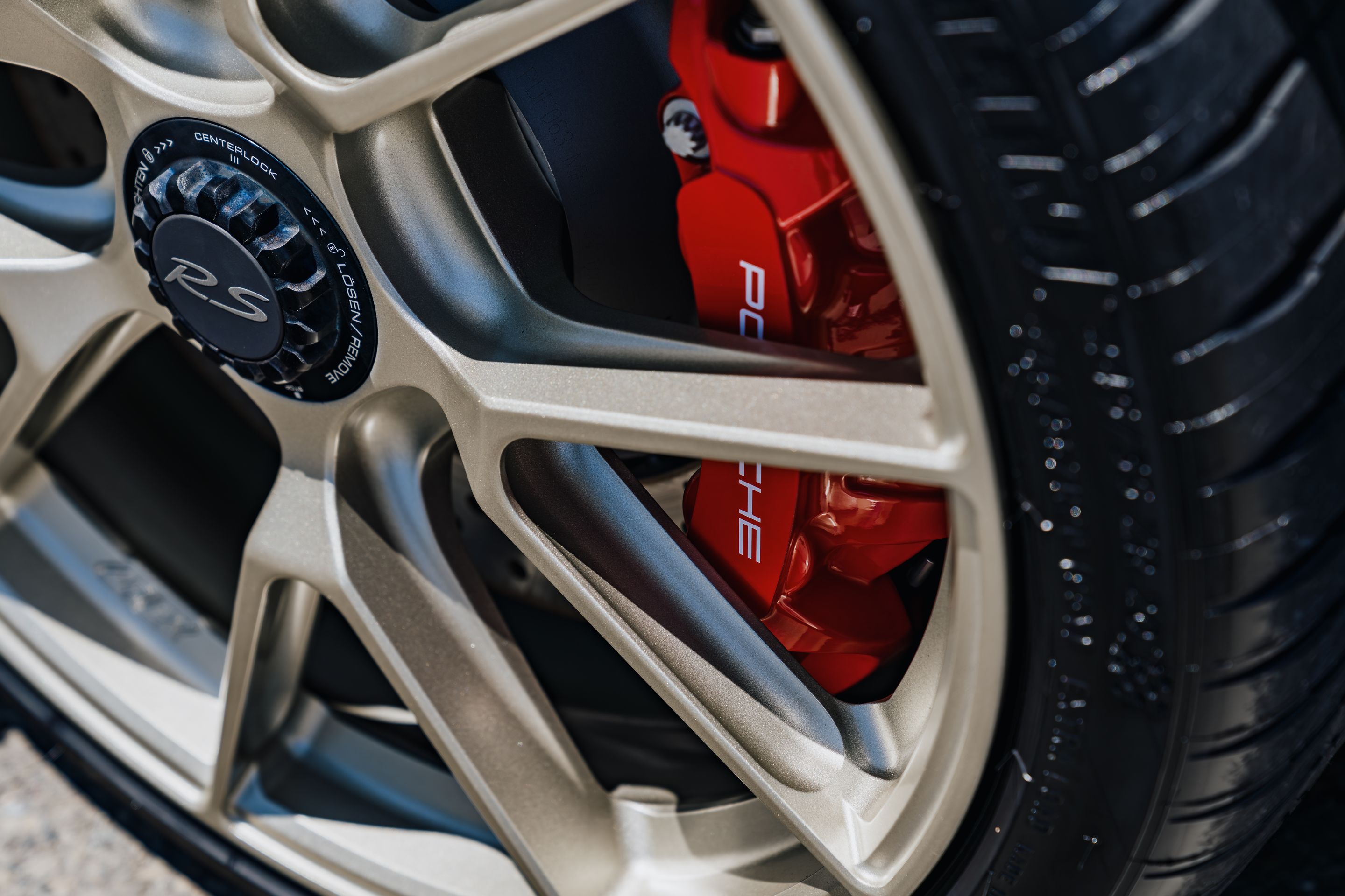 Blue Porsche 718 Cayman GT4 RS with 20" VS-5RS Apex wheels in Motorsport Gold