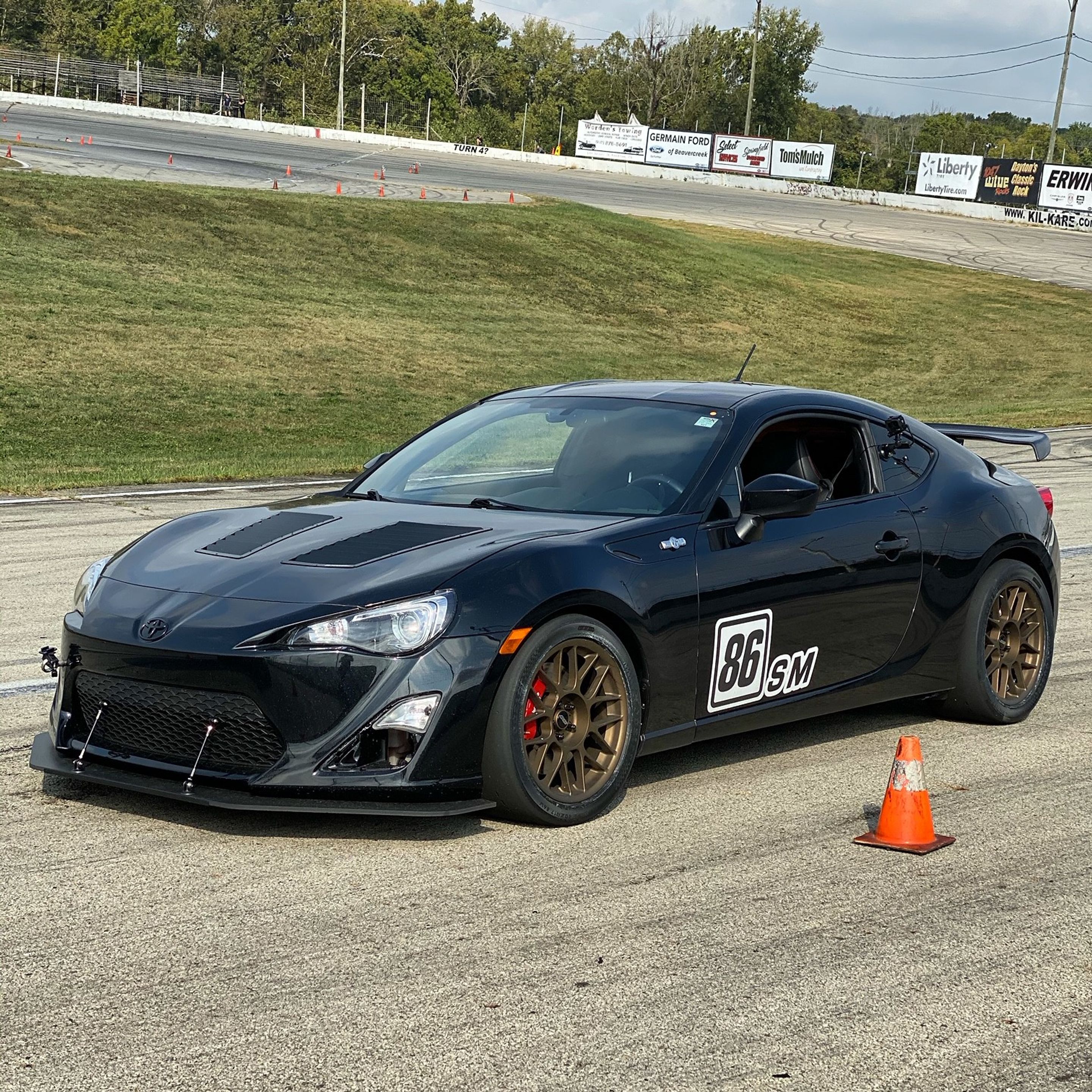Black Scion FR-S with 17" ARC-8 Apex wheels in Satin Bronze